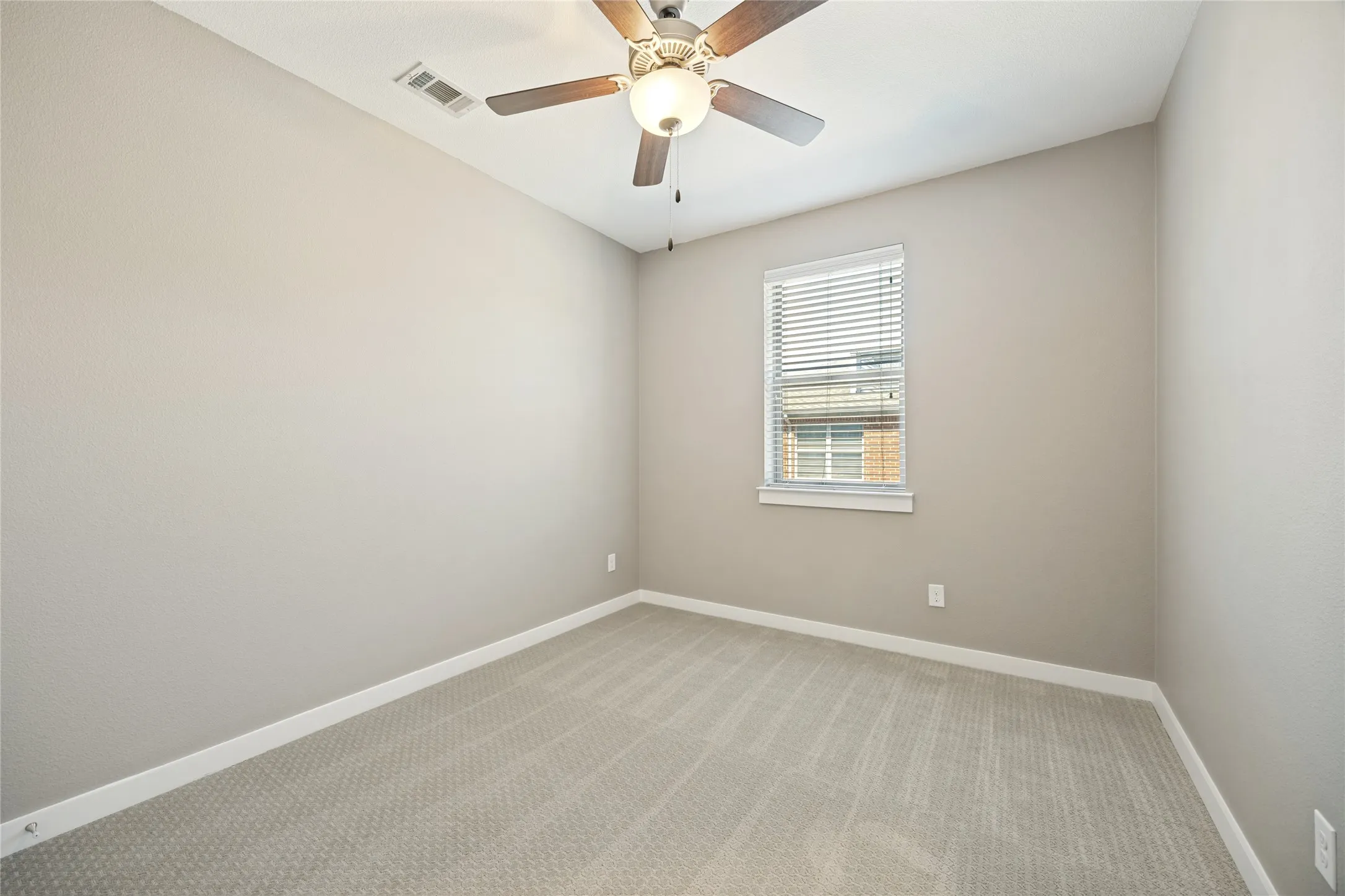Bedroom 3 with new textured carpet, ceiling fans and east facing for the morning sun to start the day.