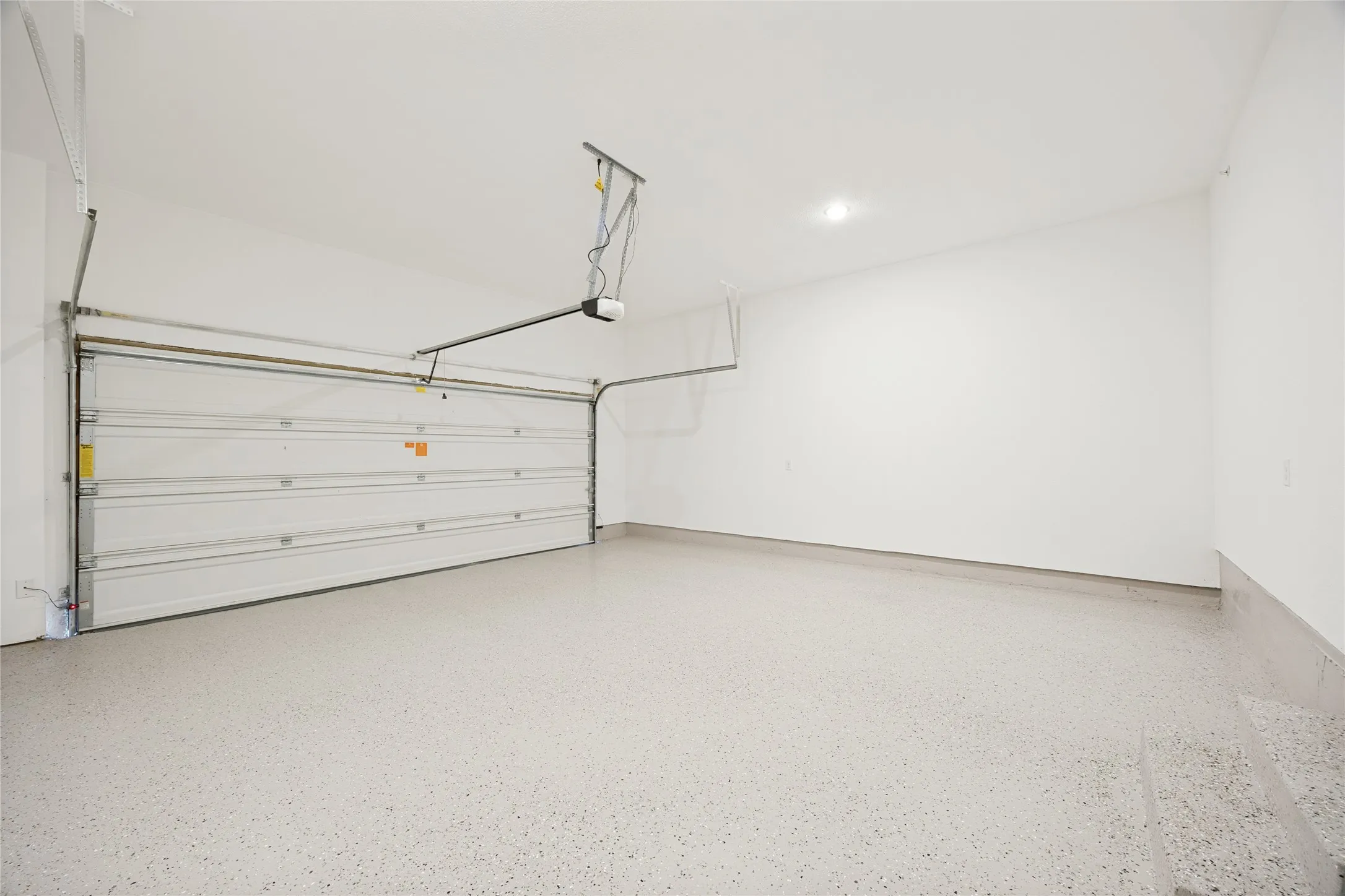 Spacious, rear access, two car garage has brand new epoxy flooring. This makes getting in and out of your home and onto the things you need to get to a breeze. Parking is private, with ample street access for visitors.