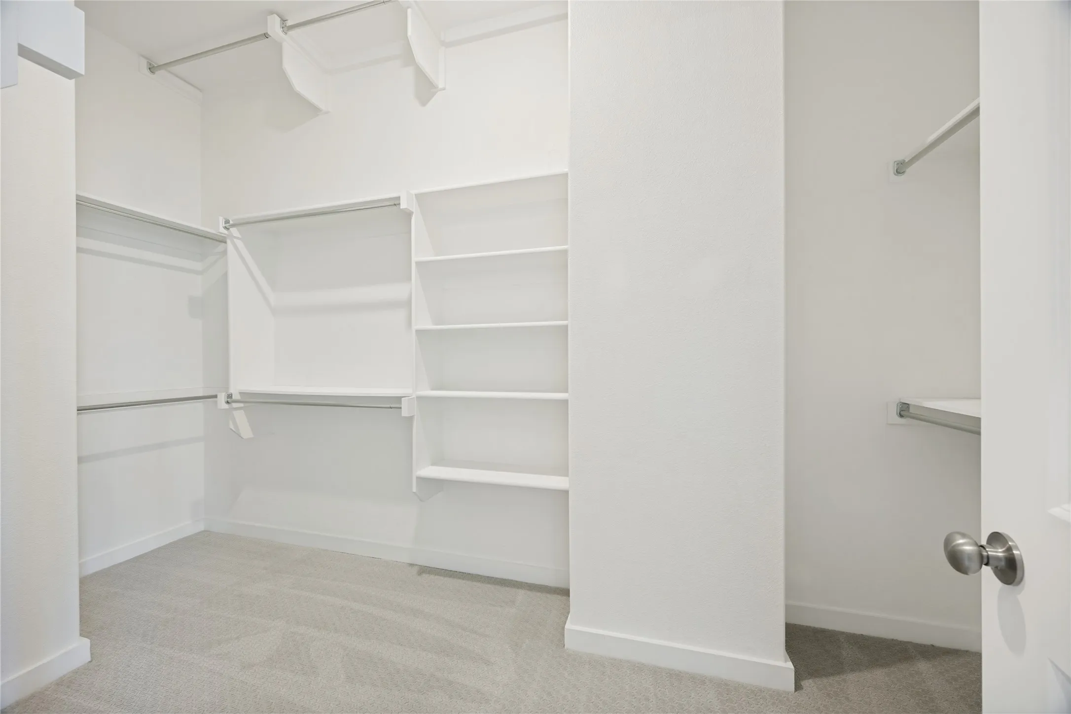 The designer closet has built in organization, and shelving from floor to ceiling. No wasted space here, you can fill it to the top.