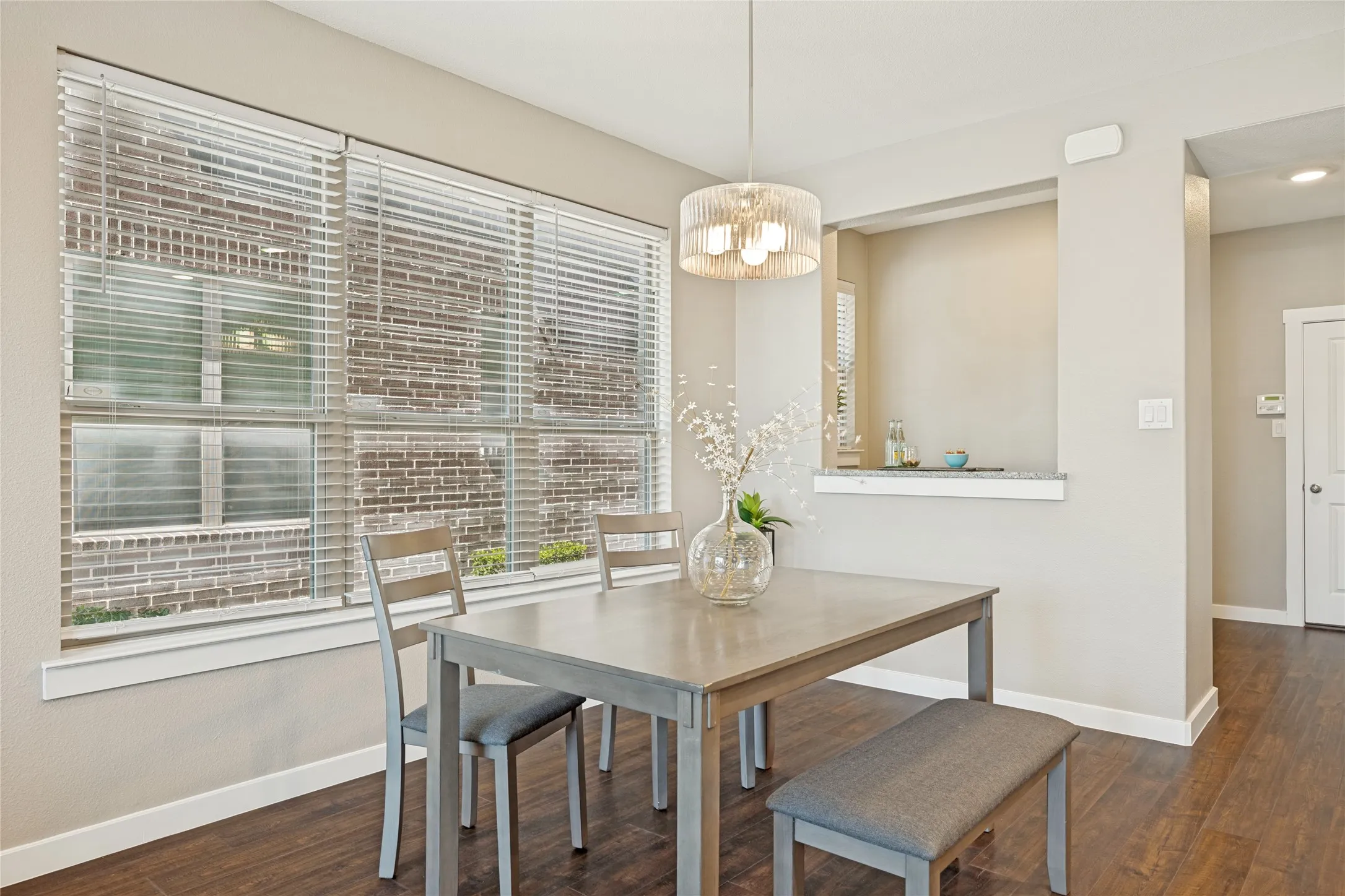The dining area here has ample light pouring in through the windows, and a pass through to the bar area, in case you need to 'pour more' for your guests.