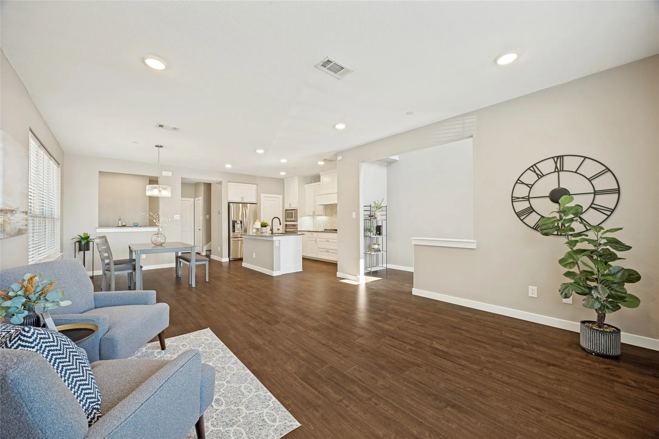 The open living room flows beautifully from living to kitchen and dining space. Fresh paint, new floors and a beautiful space to design to suit your living style.