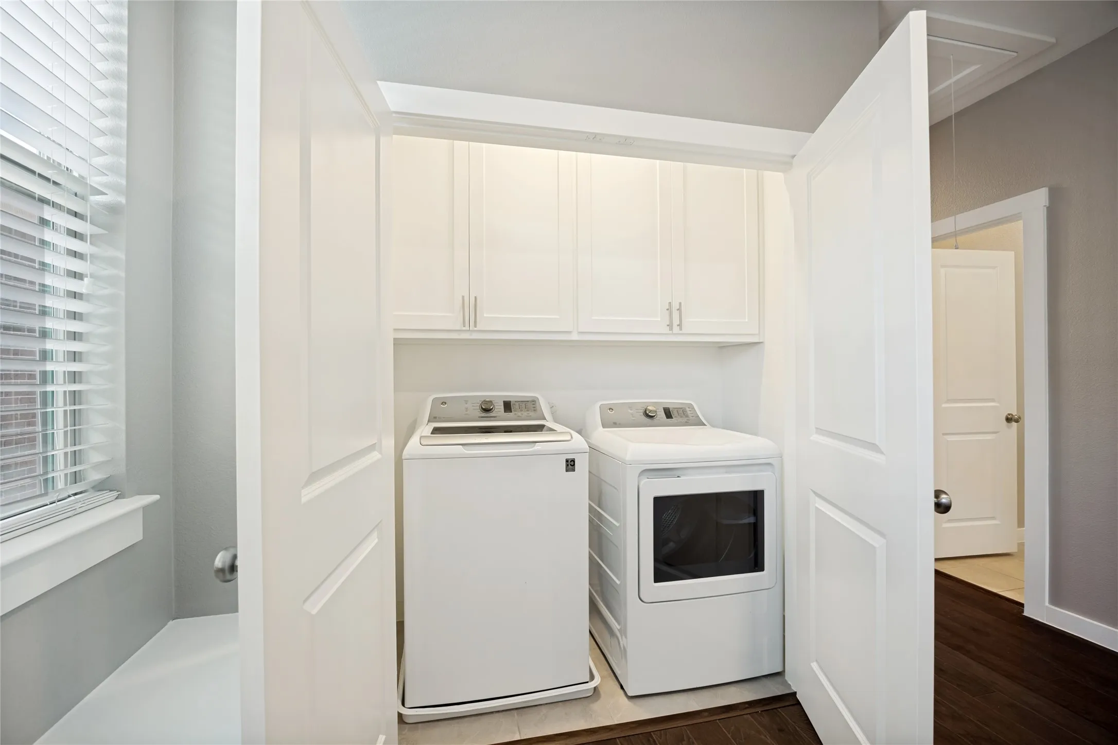 Designated full size laundry room with exhaust fan, located upstairs with all bedrooms, so laundry is done with ease. Home includes washer and dryer. This is move-in ready to make your life easier.