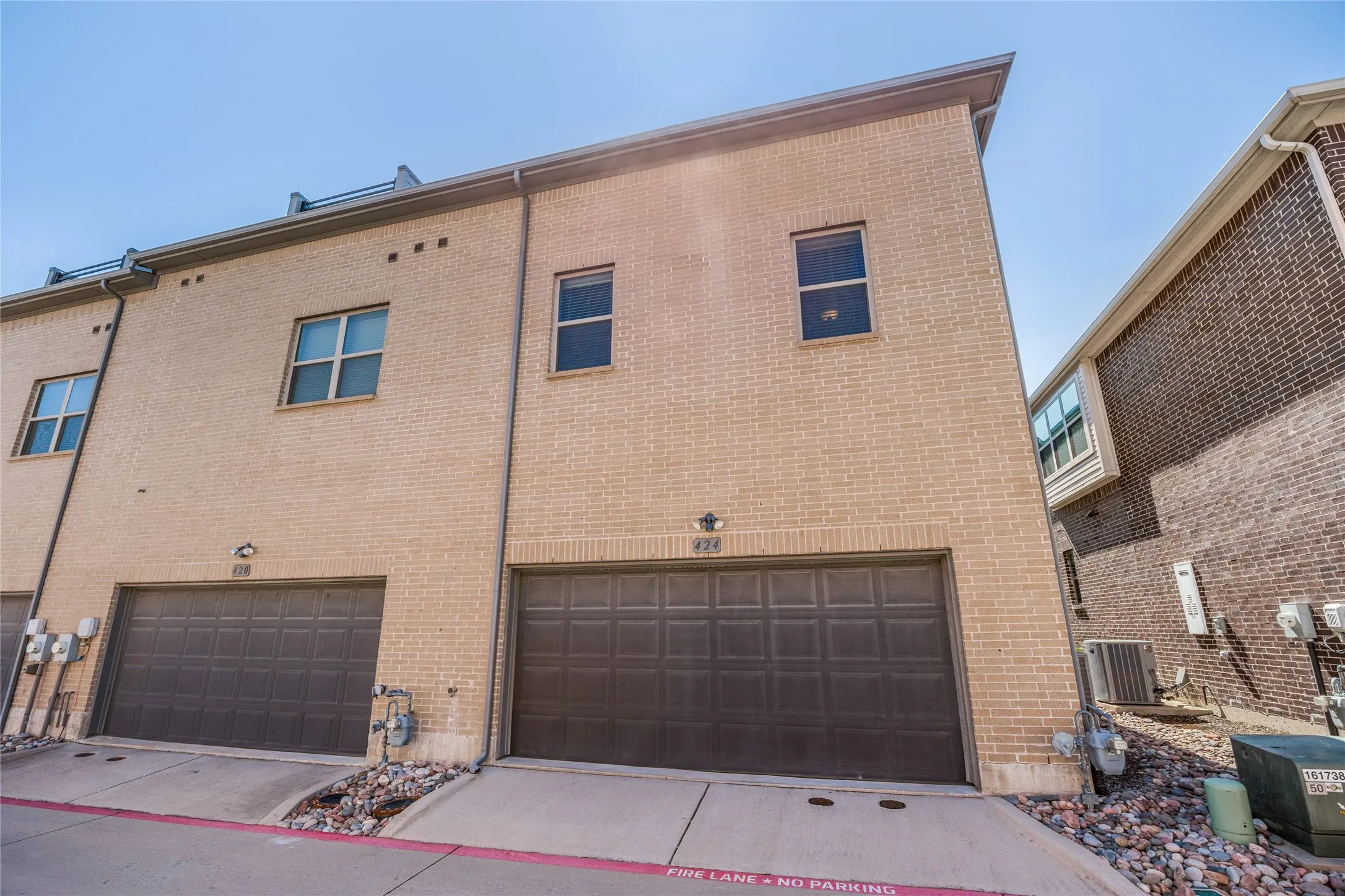 Alley access to garage, corner unit, and privacy are all met in this darling townhome in the city.