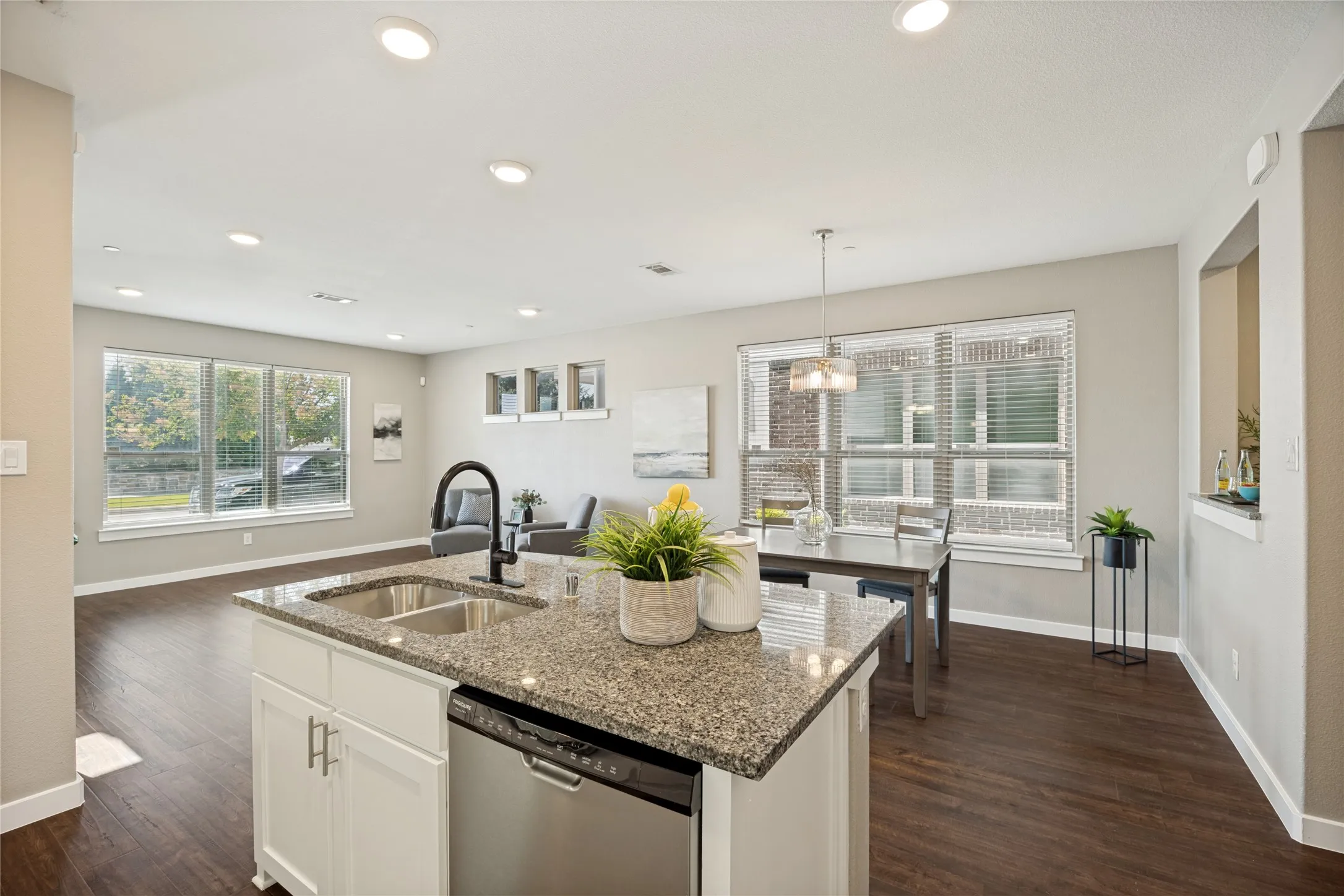 Enjoy this open space with flowing layout designed to shape space without closing you in. The kitchen is the heart of the home, and you can feel the love here.
