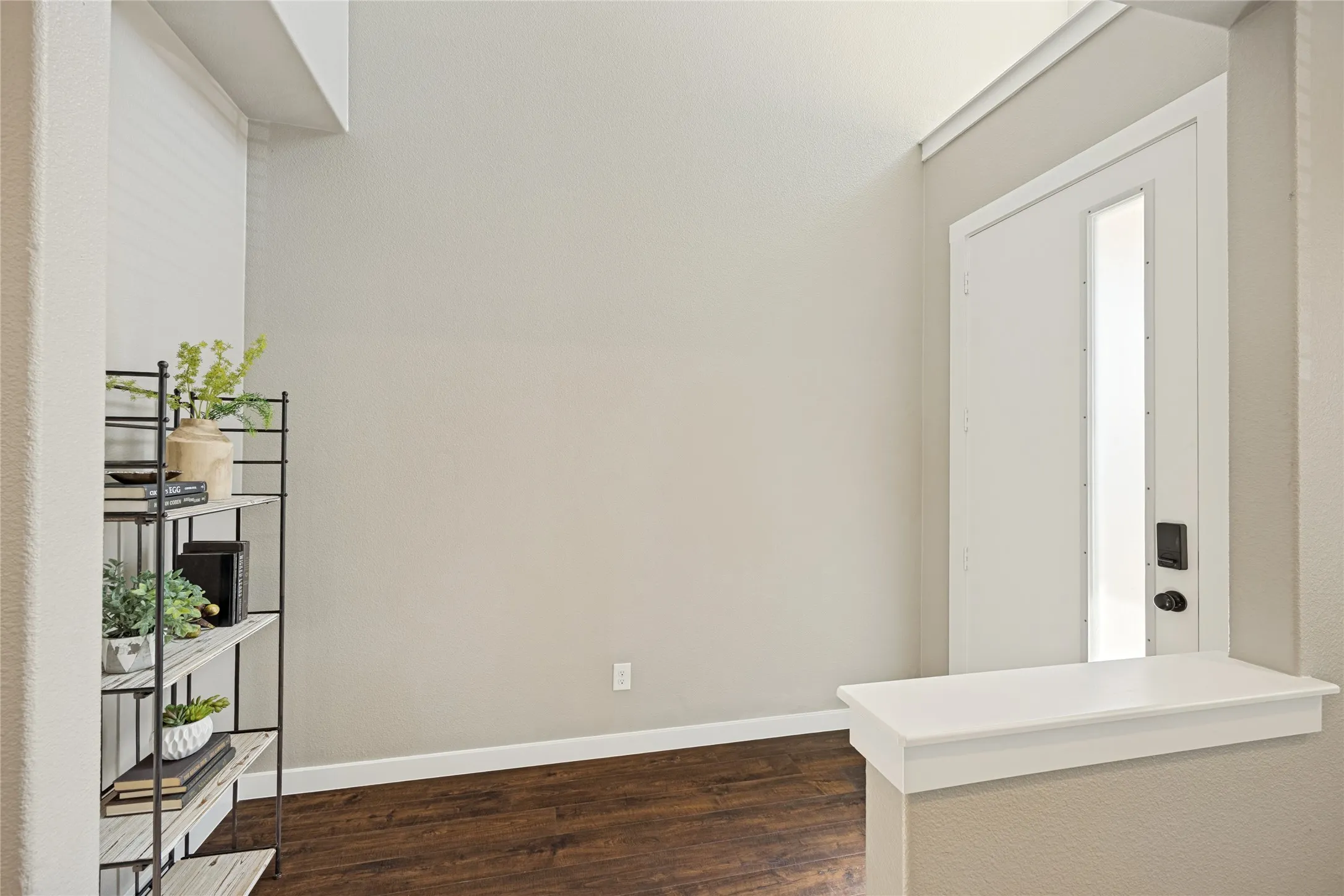 This designated entryway offers a place to greet your guest and separates the living areas from your doorway.