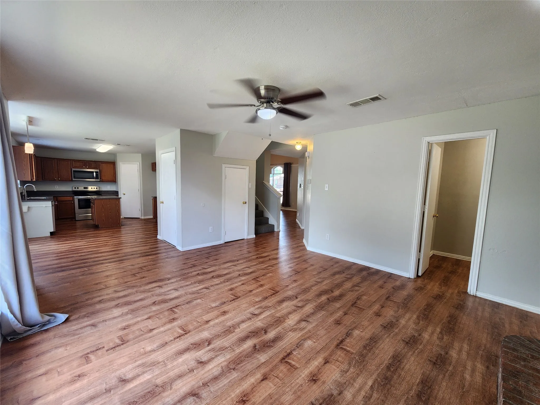 Expansive living area with wood-finish flooring