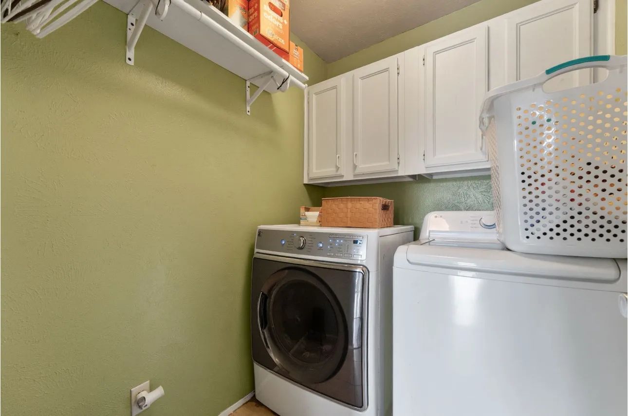 Built-in upper cabinetry and wall-mounted shelving