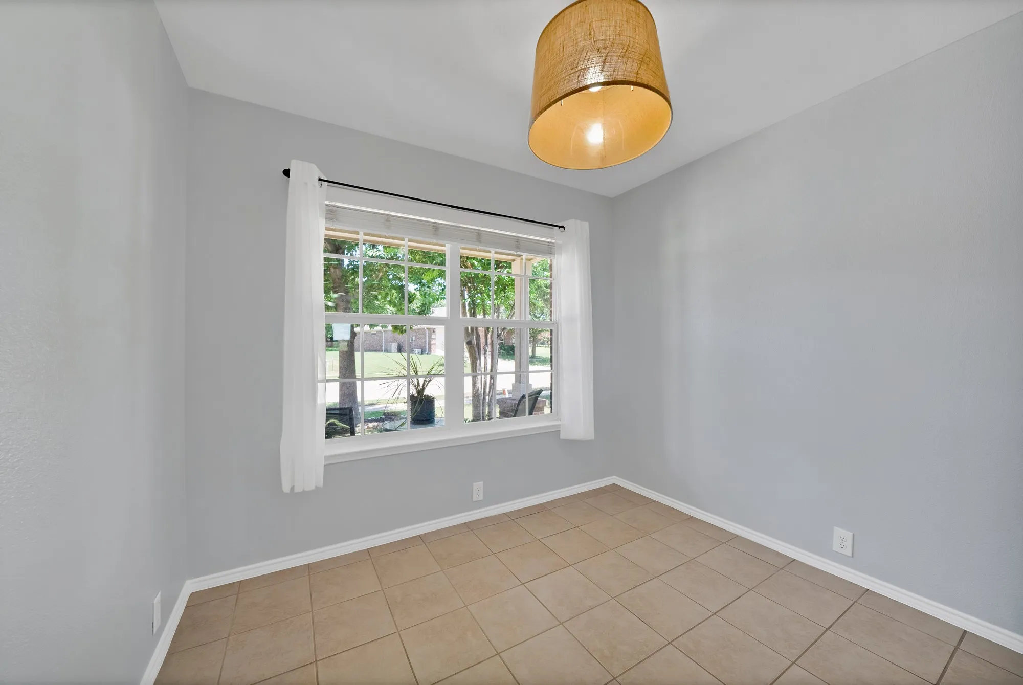 Tiled flooring paired with light gray walls