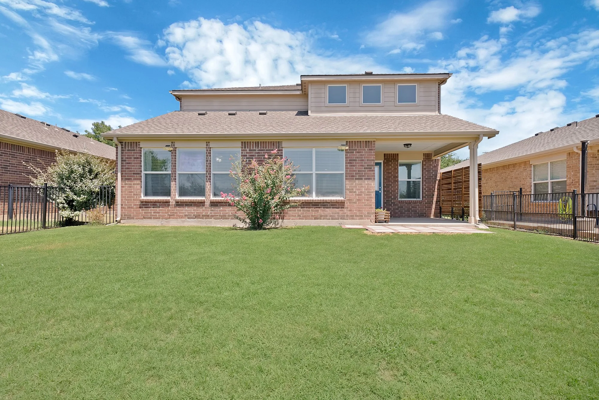 Expansive green lawn providing ample outdoor space