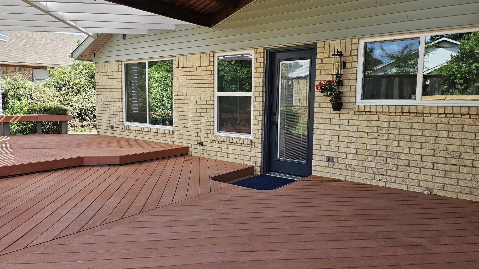 Expansive rear deck featuring multi-level wood-finish flooring