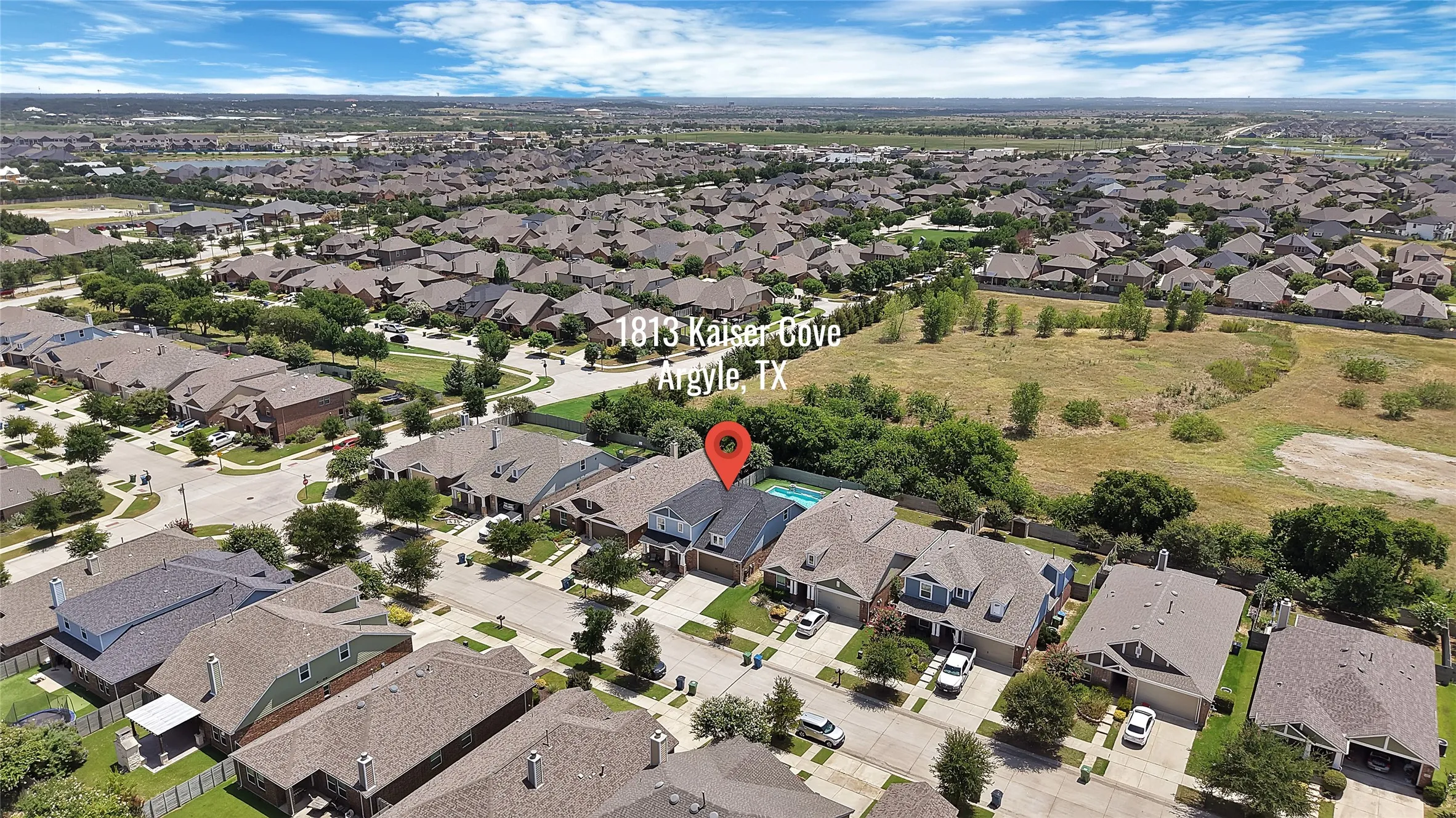 Aerial perspective showcasing a residential neighborhood with numerous single-family homes