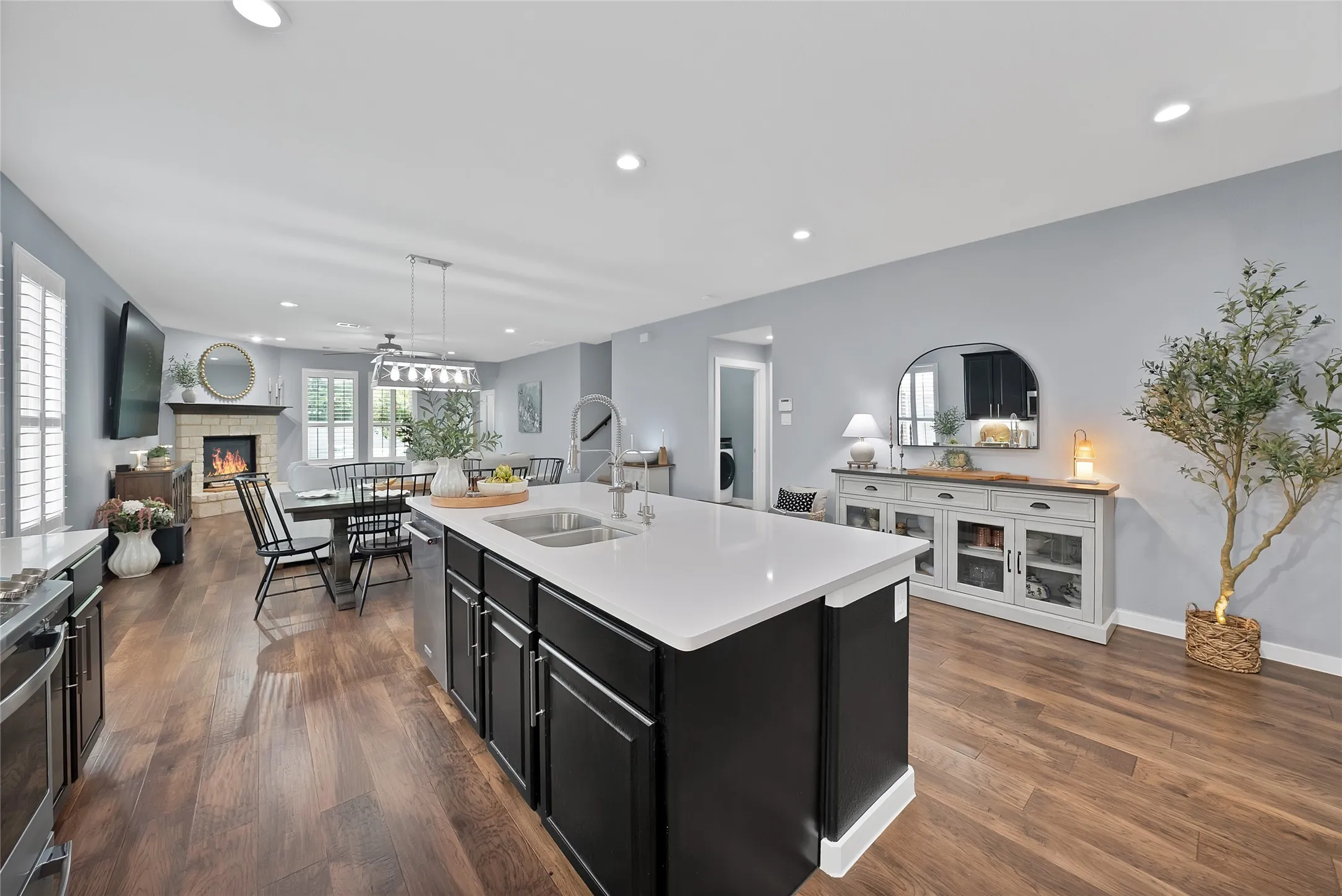 Spacious kitchen island with white countertop and integrated sink