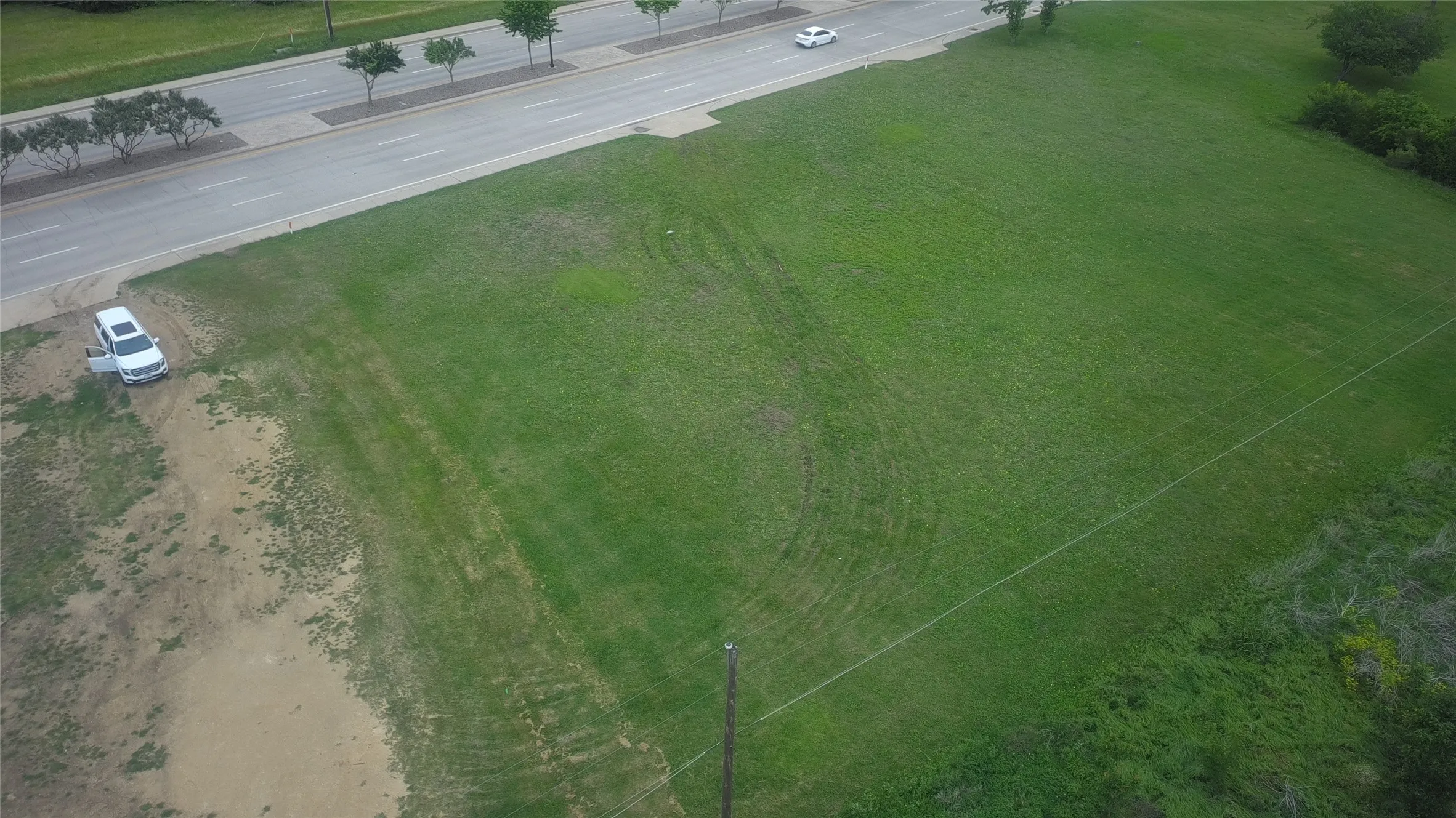 Expansive green space featuring a clear, level surface