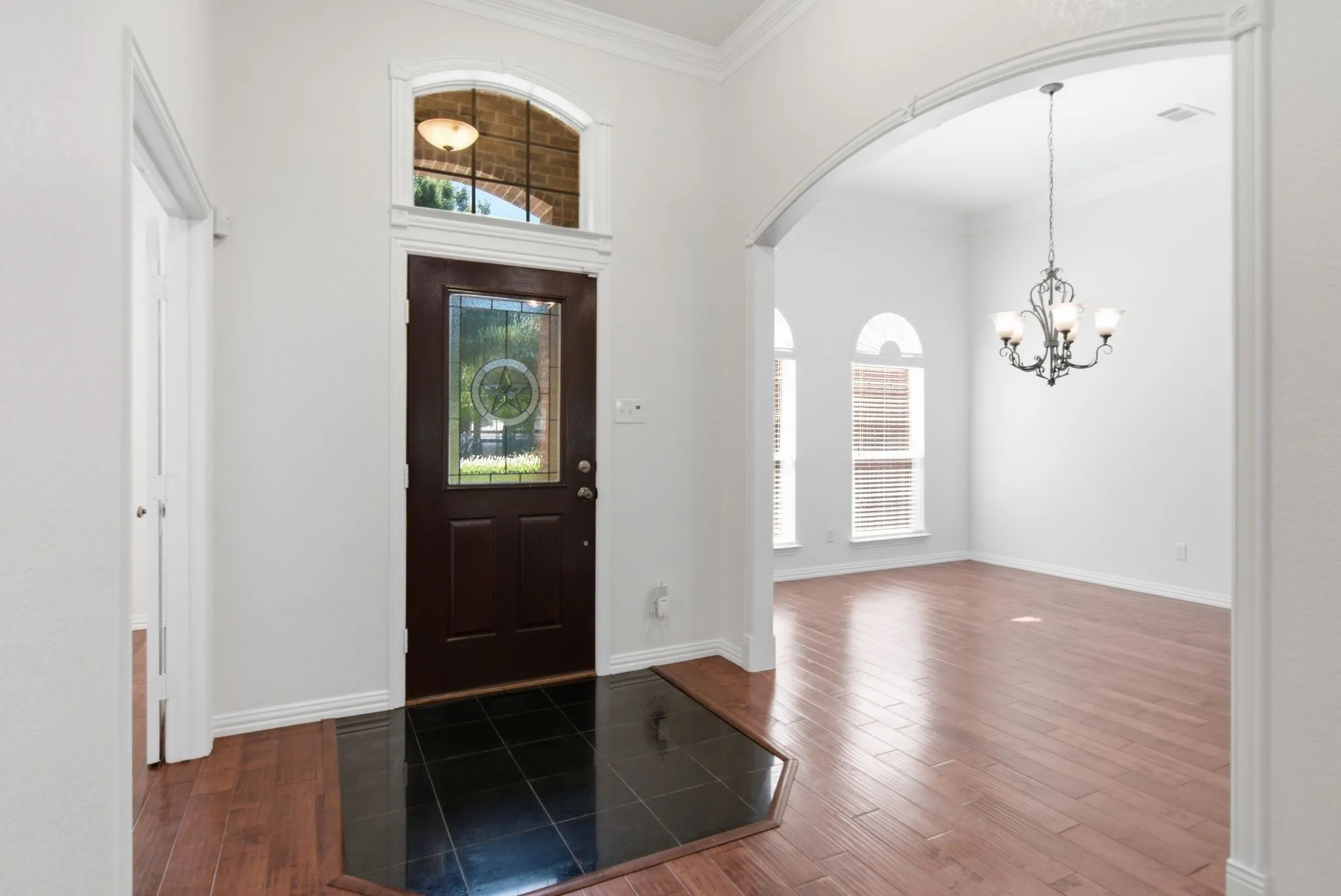 Entry with transom window, leaded glass door, black marble entry tile!