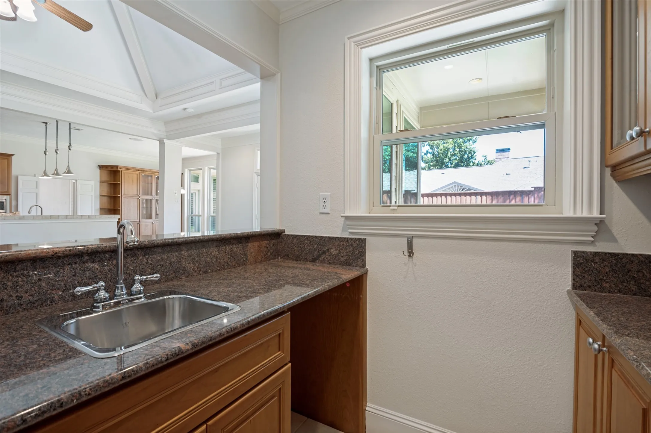 Wet bar with sink and storage.