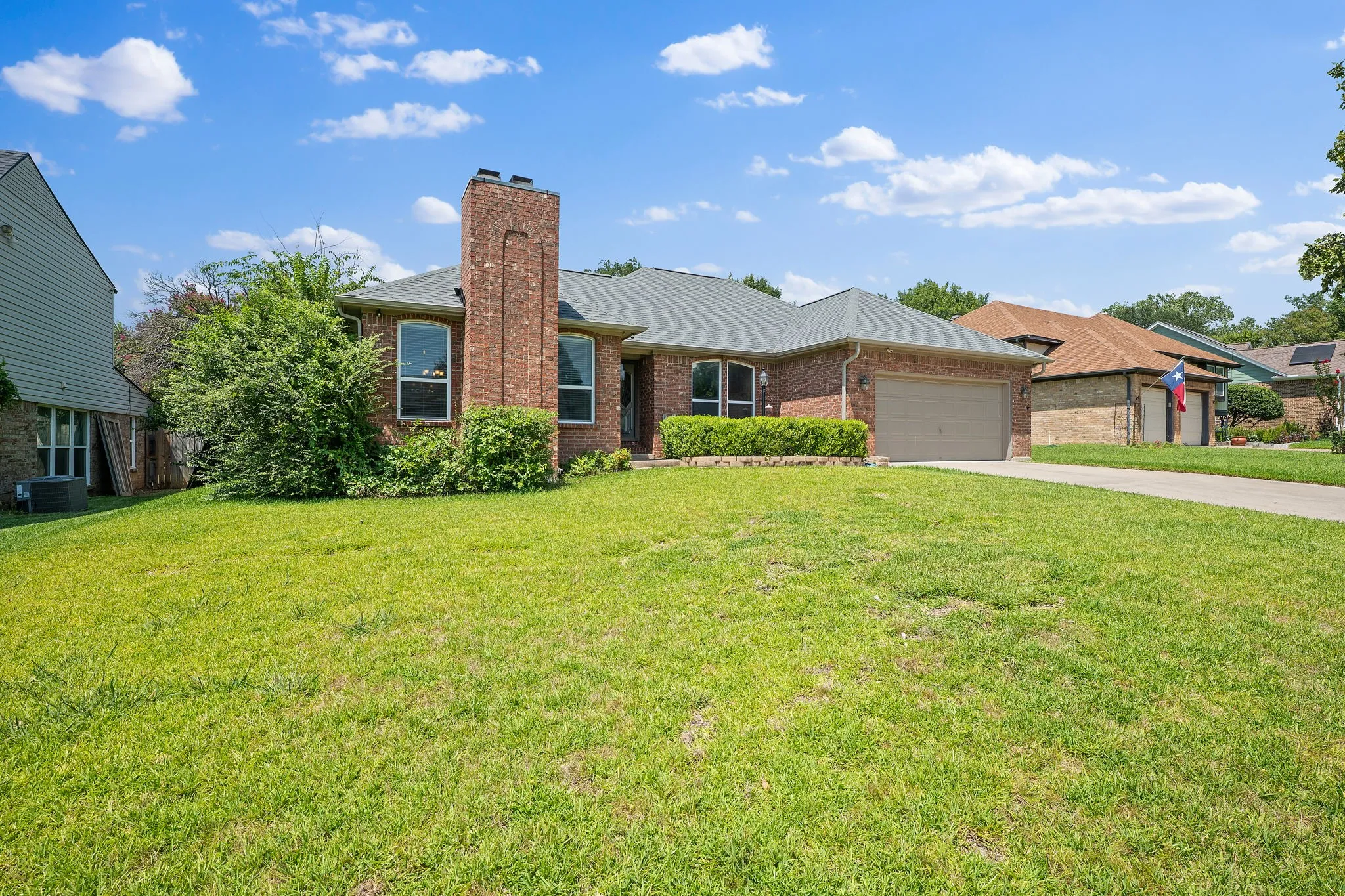 Brick exterior with a prominent chimney feature