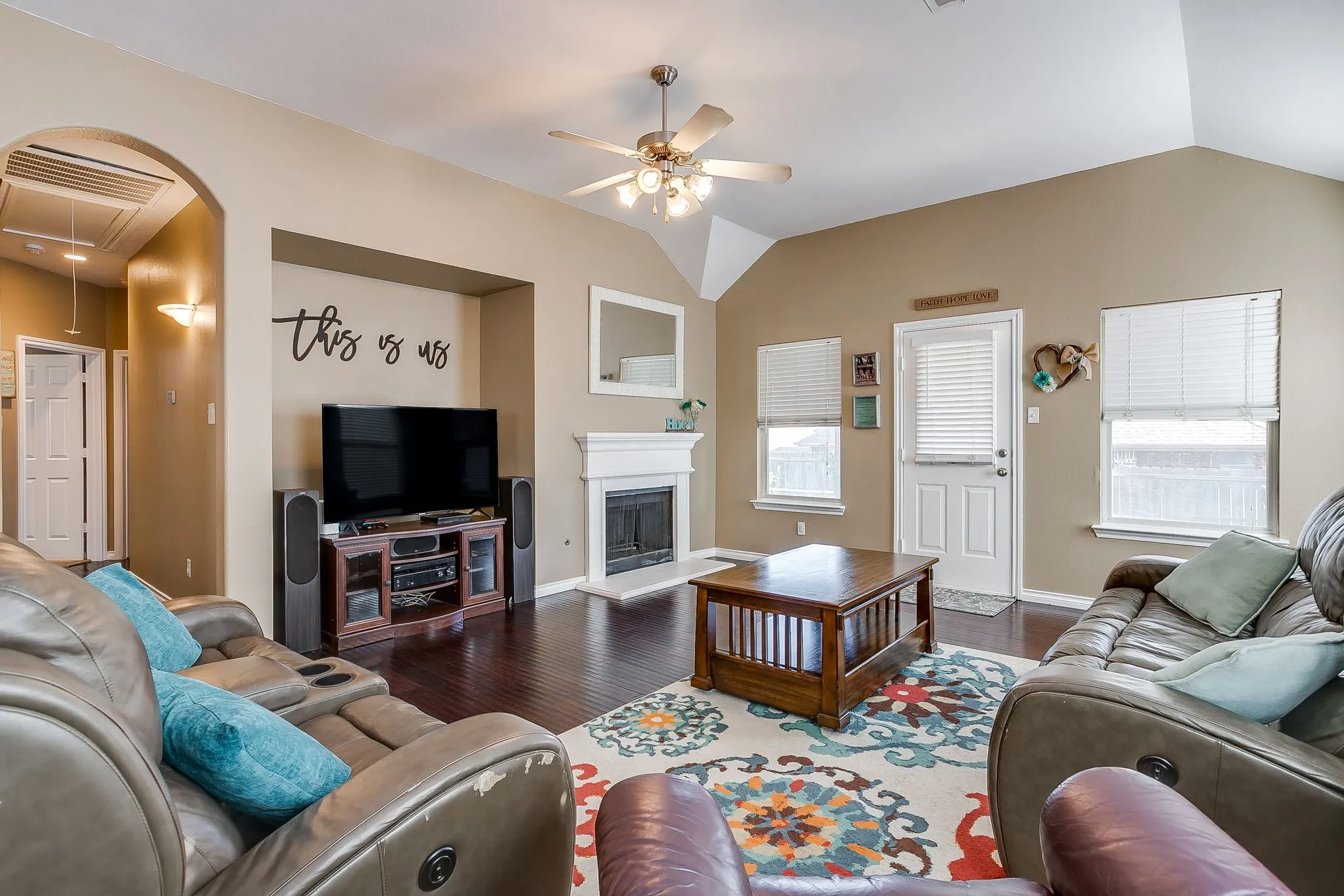 Living room with ceiling fan.