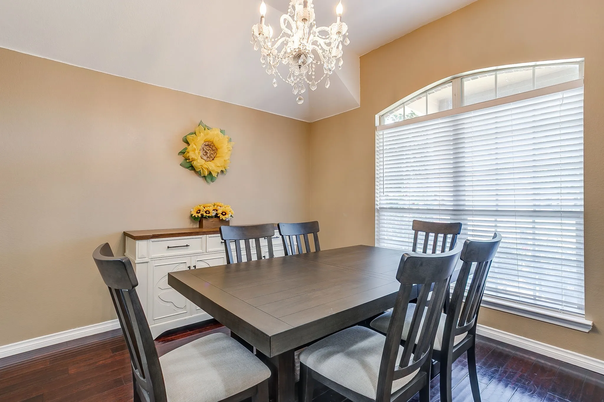 Formal dining area with chandelier.