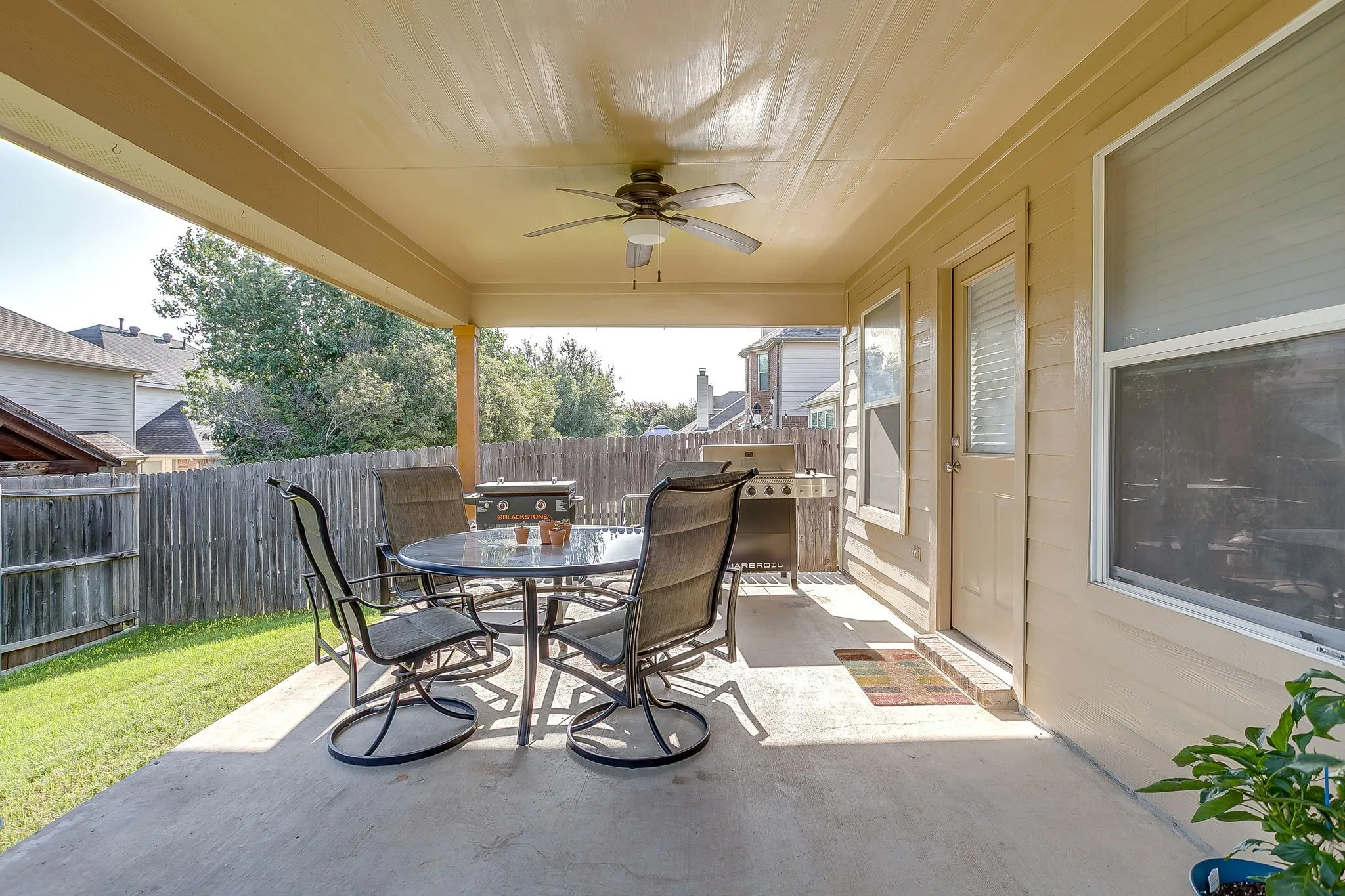 Covered back patio with ceiling fan already installed.