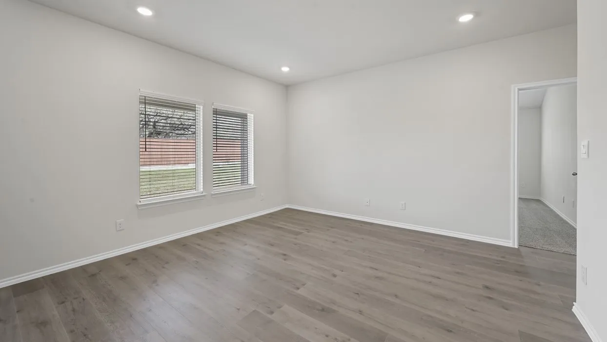 Bright interior space featuring light wood-finish flooring and recessed lighting