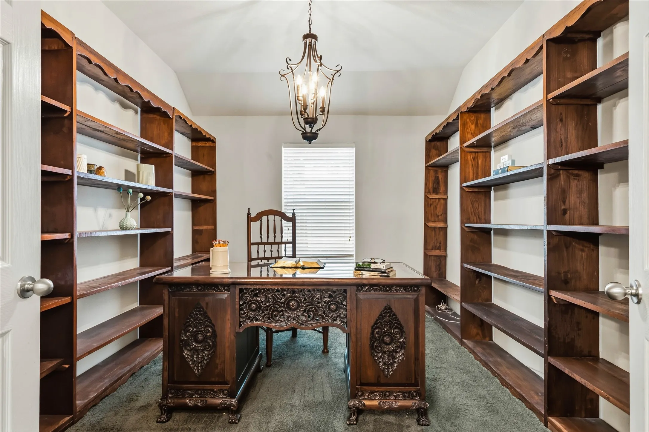 Home office lined with bookshelves
