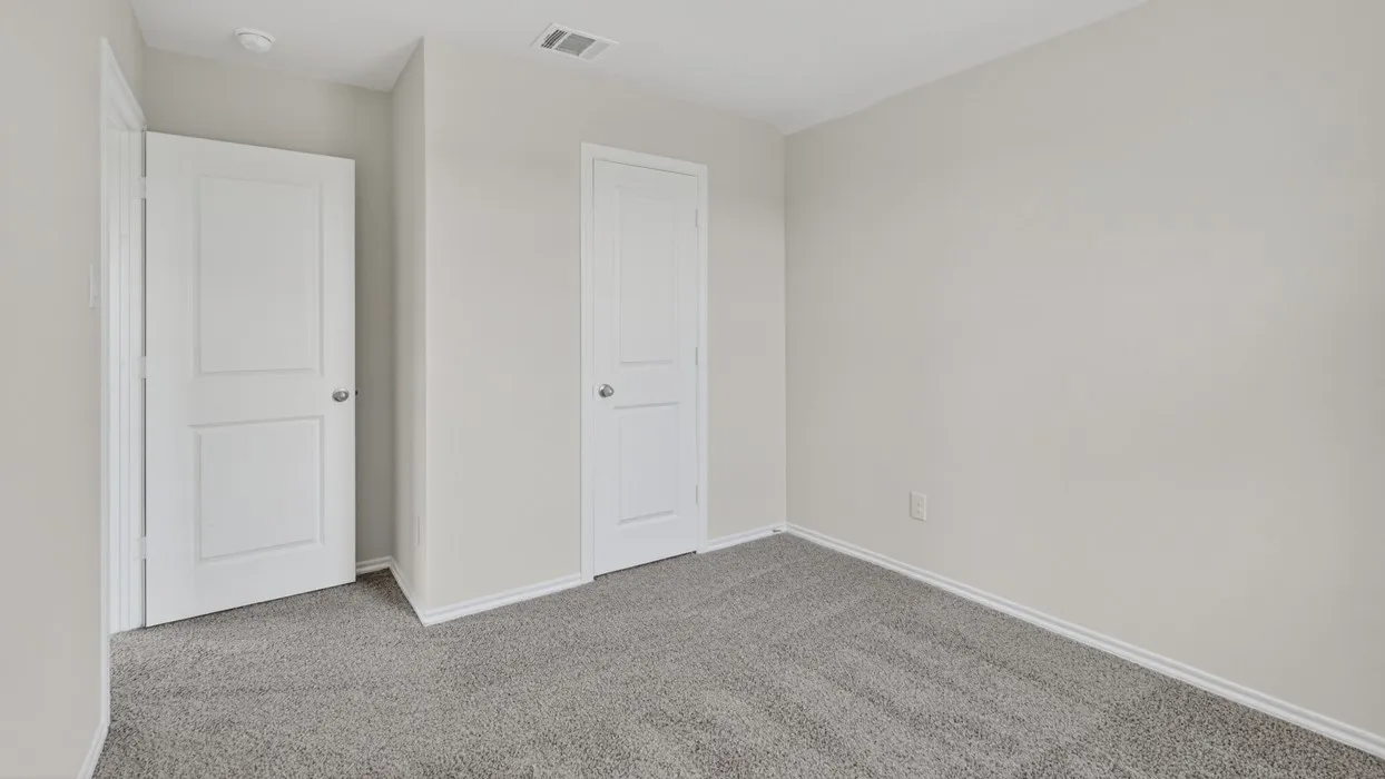 Neutral gray carpeting complements freshly painted light gray walls