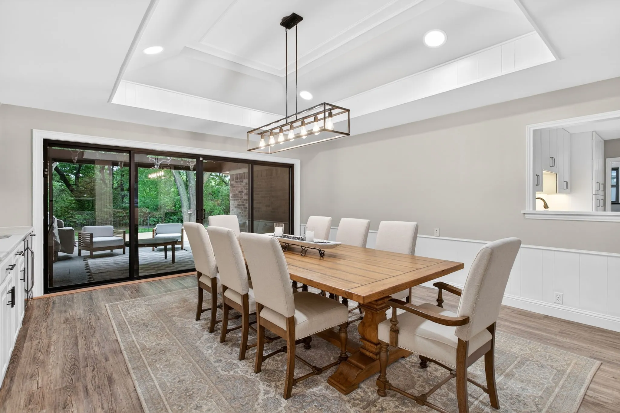 Dining area with wood-finish flooring and a coffered ceiling