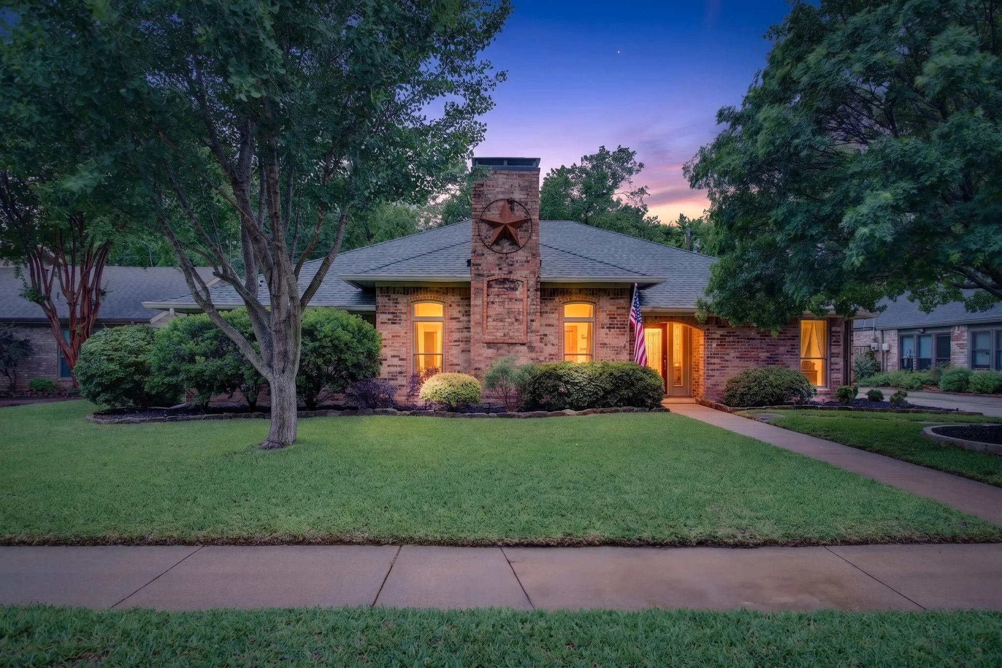 Brick exterior featuring a prominent chimney with a decorative star