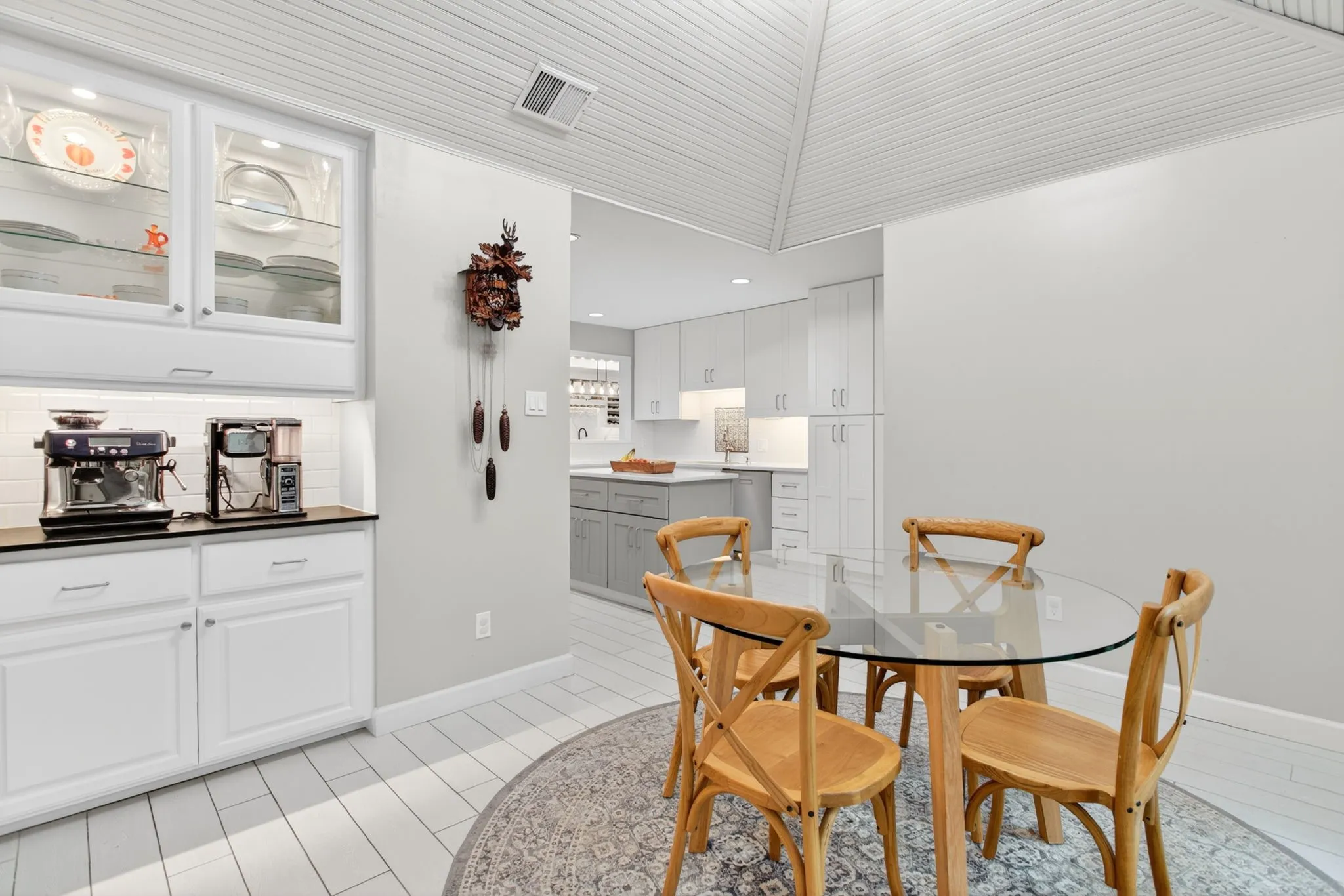 Built-in cabinetry with glass-front uppers and under-cabinet lighting
