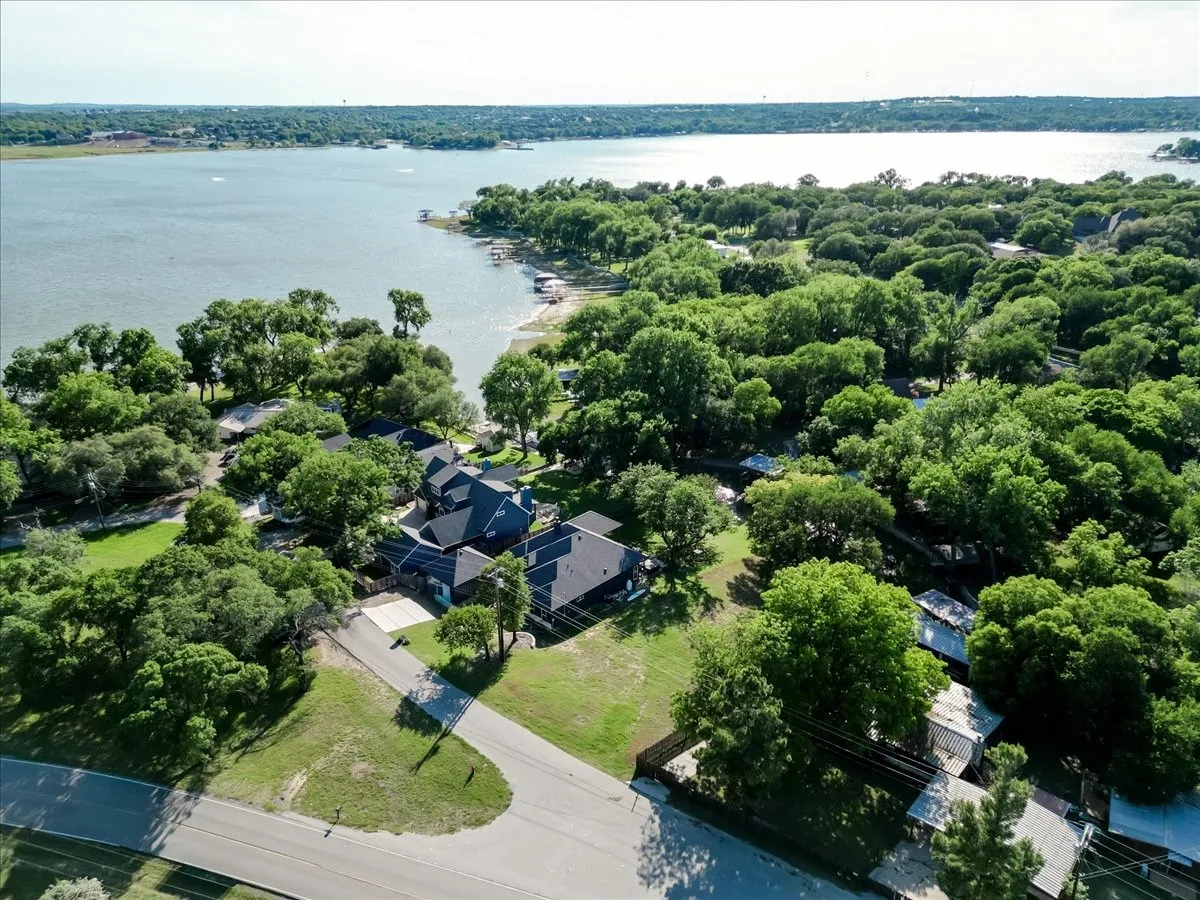 Expansive water frontage property with mature tree canopy and direct water access