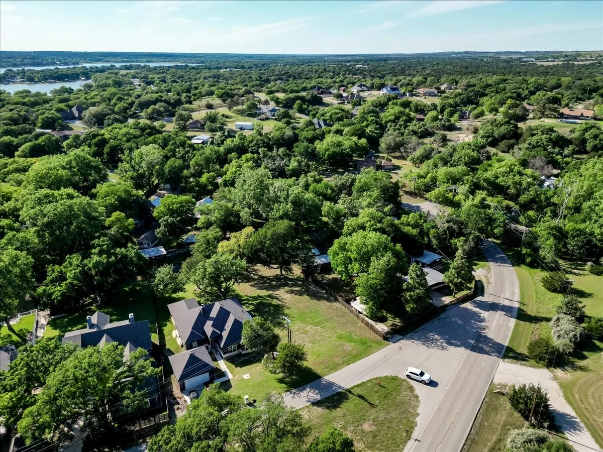 Expansive lot featuring a contemporary residence with a dark-toned roof