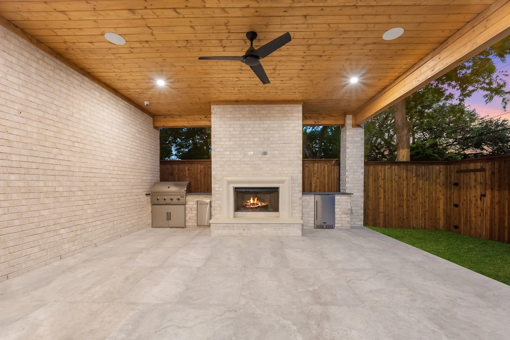 Covered patio featuring a wood-paneled ceiling, recessed lighting, and a ceiling fan