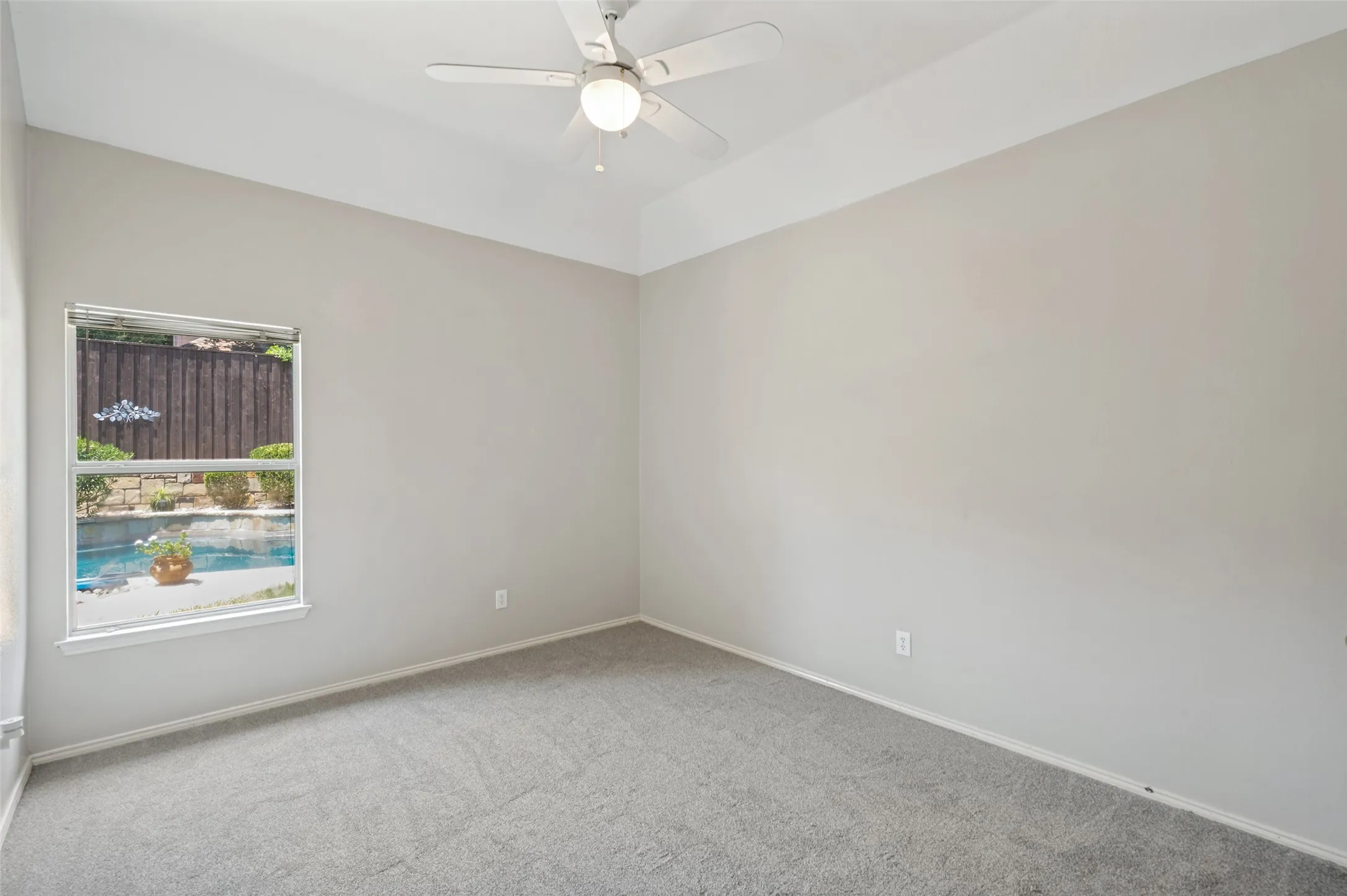 secondary bedroom facing back of home
