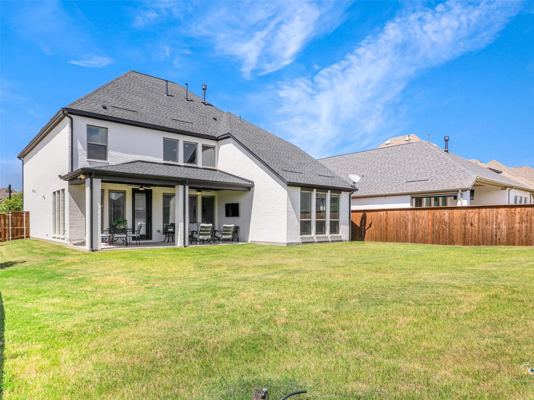 The covered patio creates the perfect setting for year-round entertaining while leaving ample room to design the backyard of your dreams