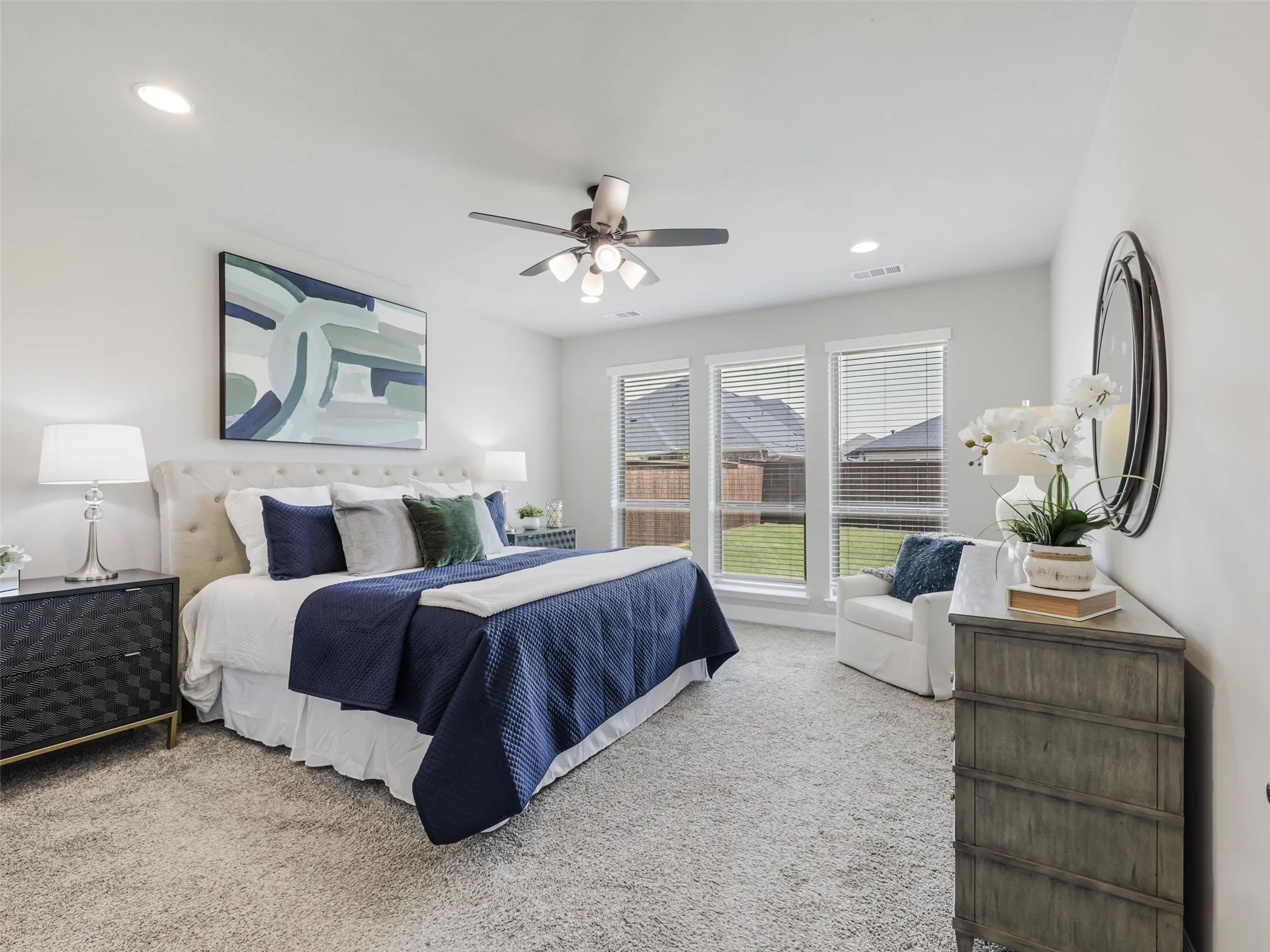 Spacious Primary Bedroom with lot sof natural light and views to the oversized backyard