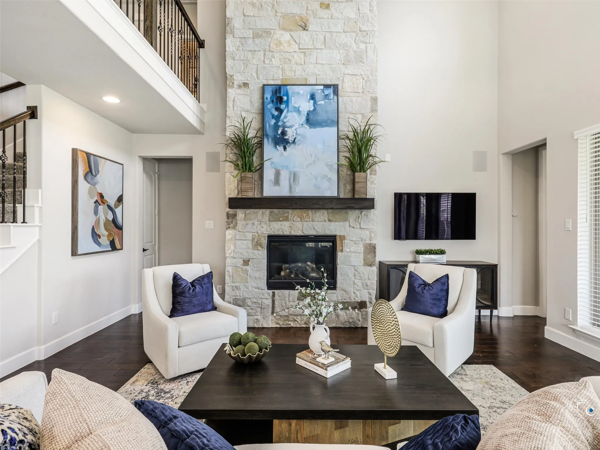 Another view of the floor to ceiling stone fireplace