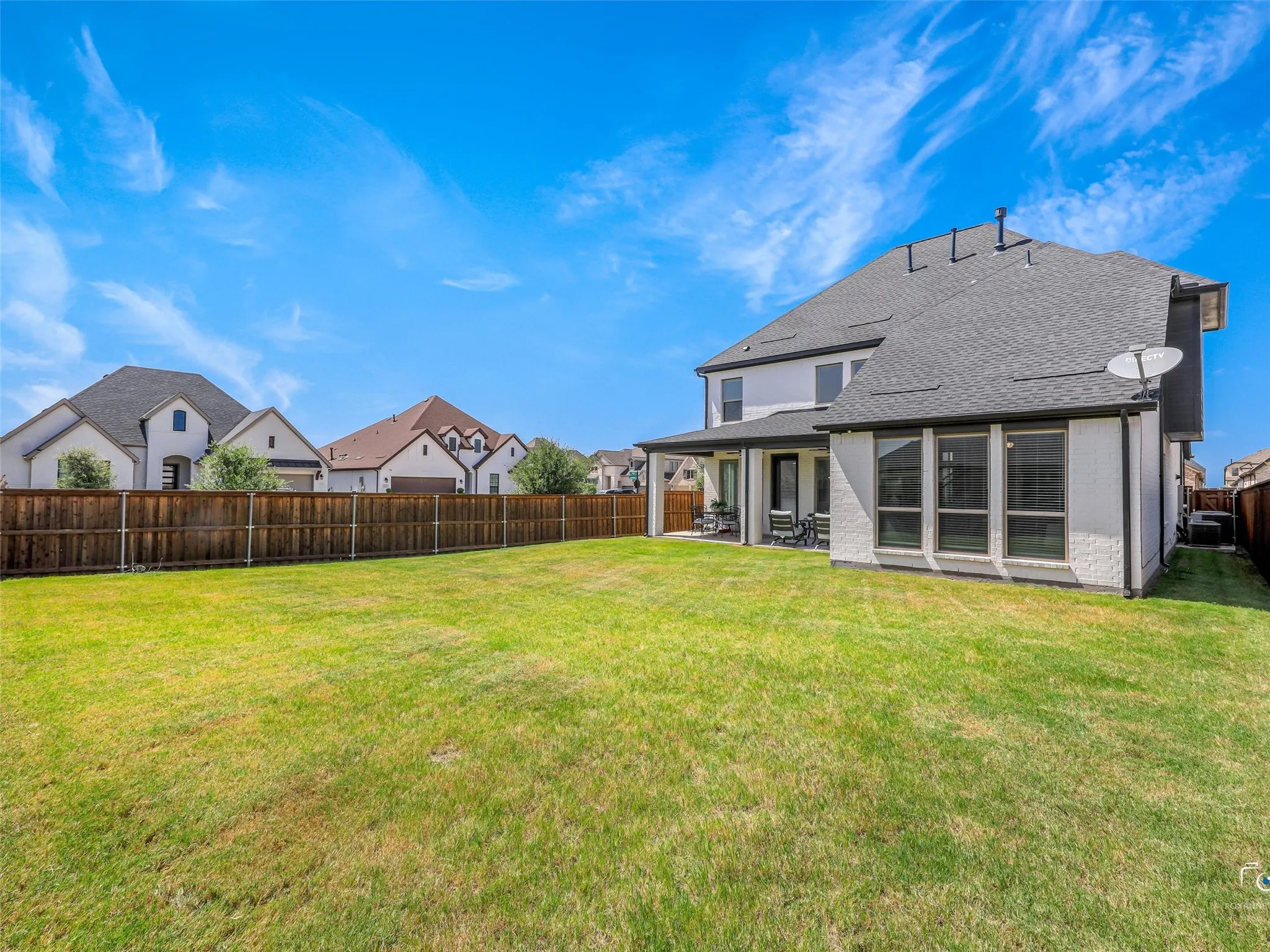 The large backyard offers endless possibilities for future outdoor living.