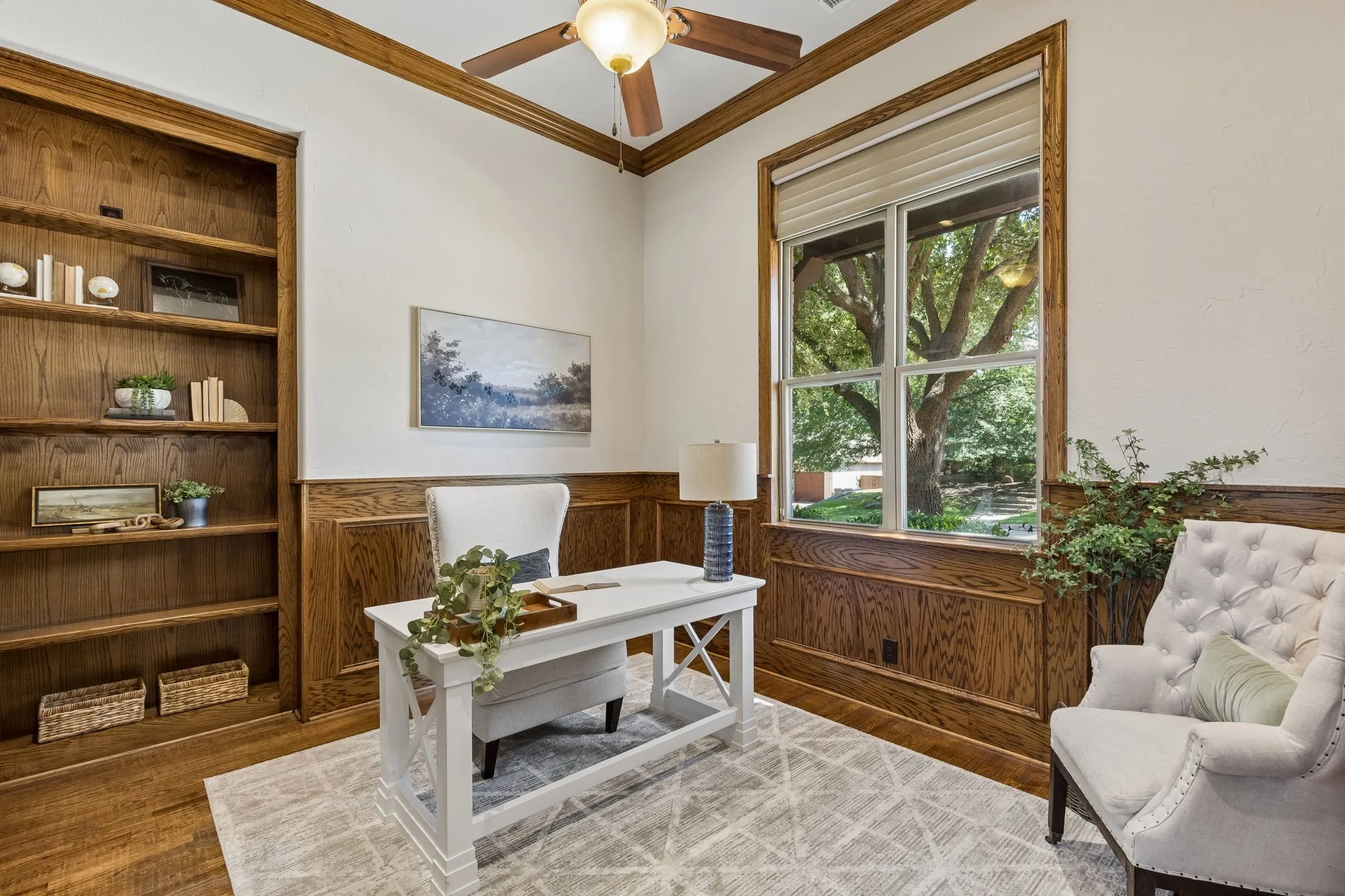 Situated on a diagonal, the office is warm and cozy. We love the built in book case and wall paneling.