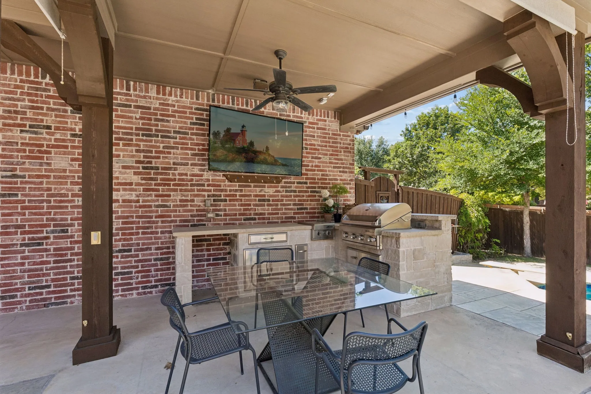 One of 2 extended covered spaces. This one is perfect for watching Sunday sports and dining alfresco.