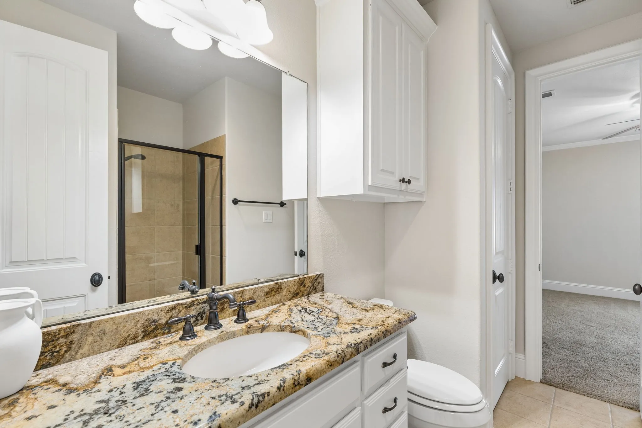 Amply appointed guest bathroom.