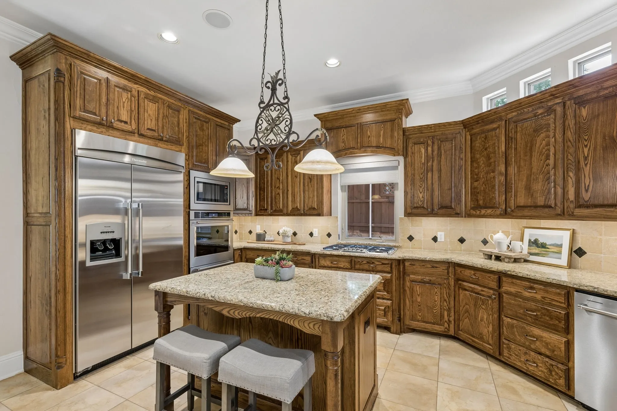 A close up of the cabinetry and appliances. For a more modern look, adding quartz countertop and blacksplash and brushed gold hardware and lighting would be stunning.