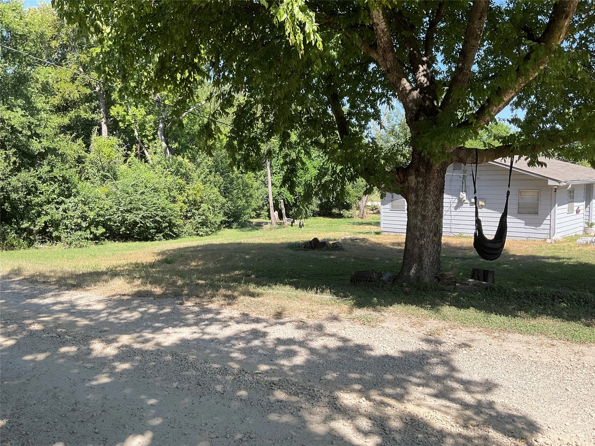 Gravel driveway To left side of home