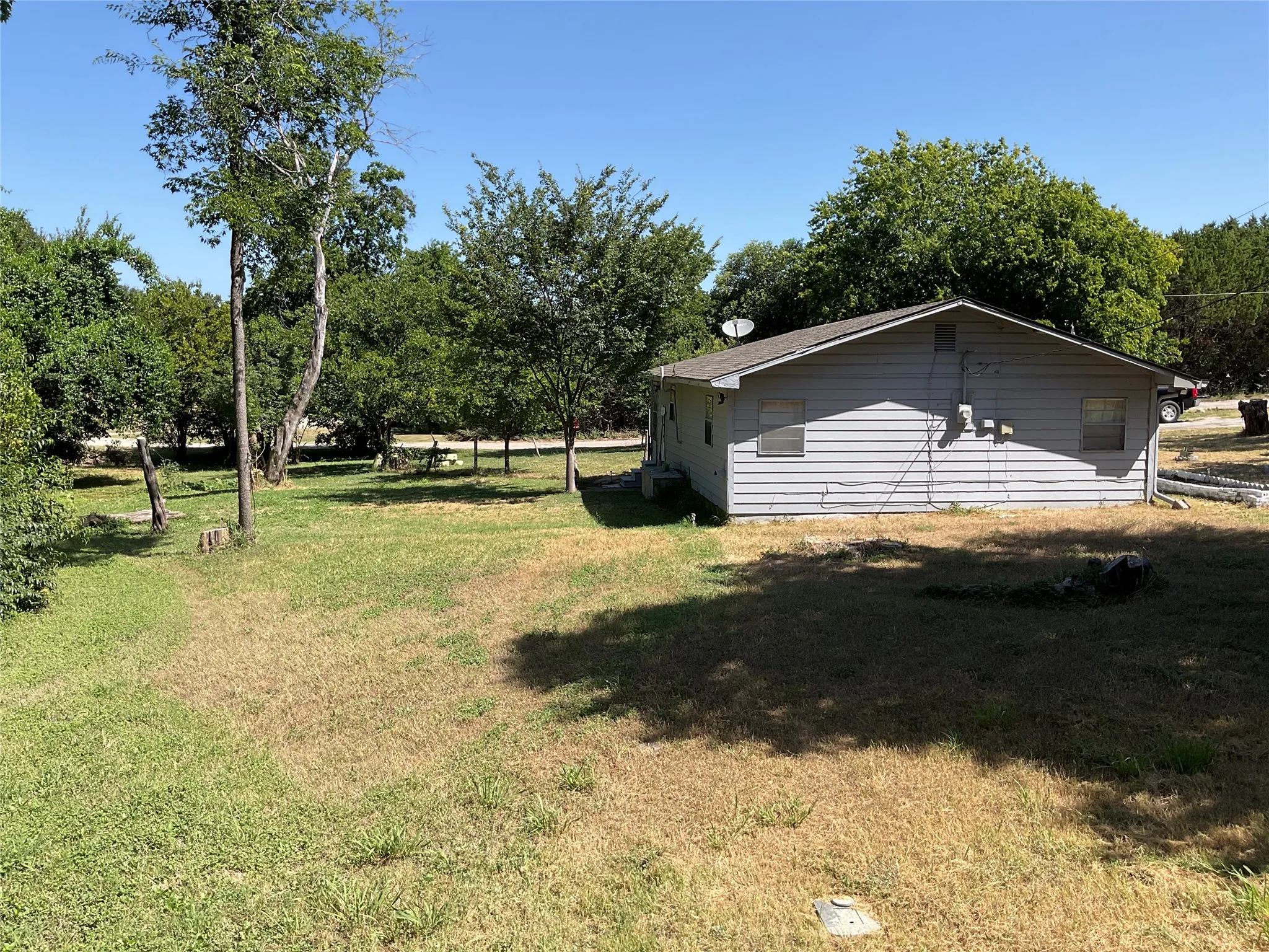 Exterior siding home with a pitched roof and multiple windows