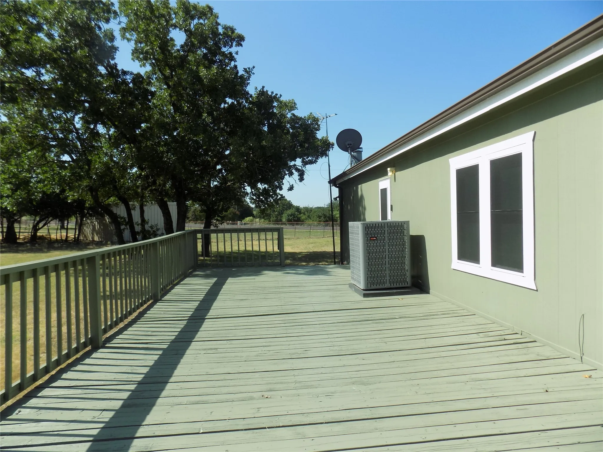 Closer view of huge back door deck; large enough for various gatherings.