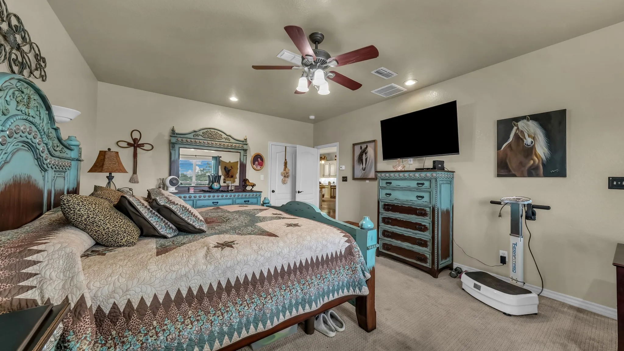 Carpeted bedroom with a vaulted ceiling, recessed lighting, and a ceiling fan