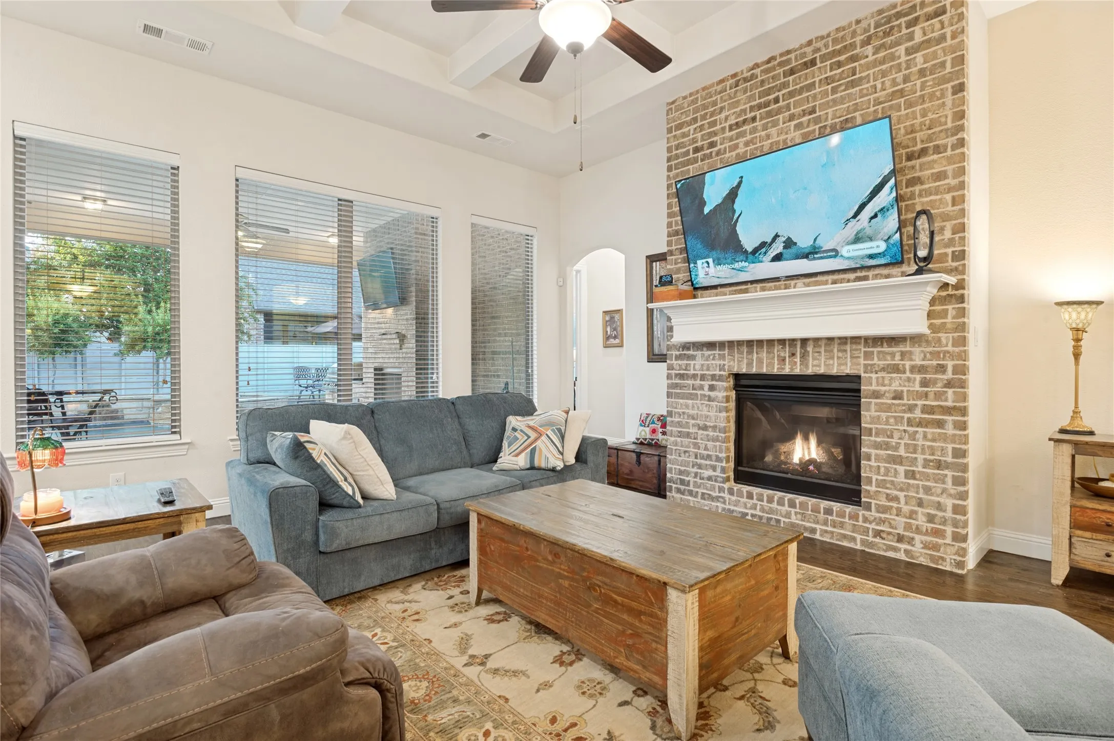 Brick fireplace with a classic white mantel