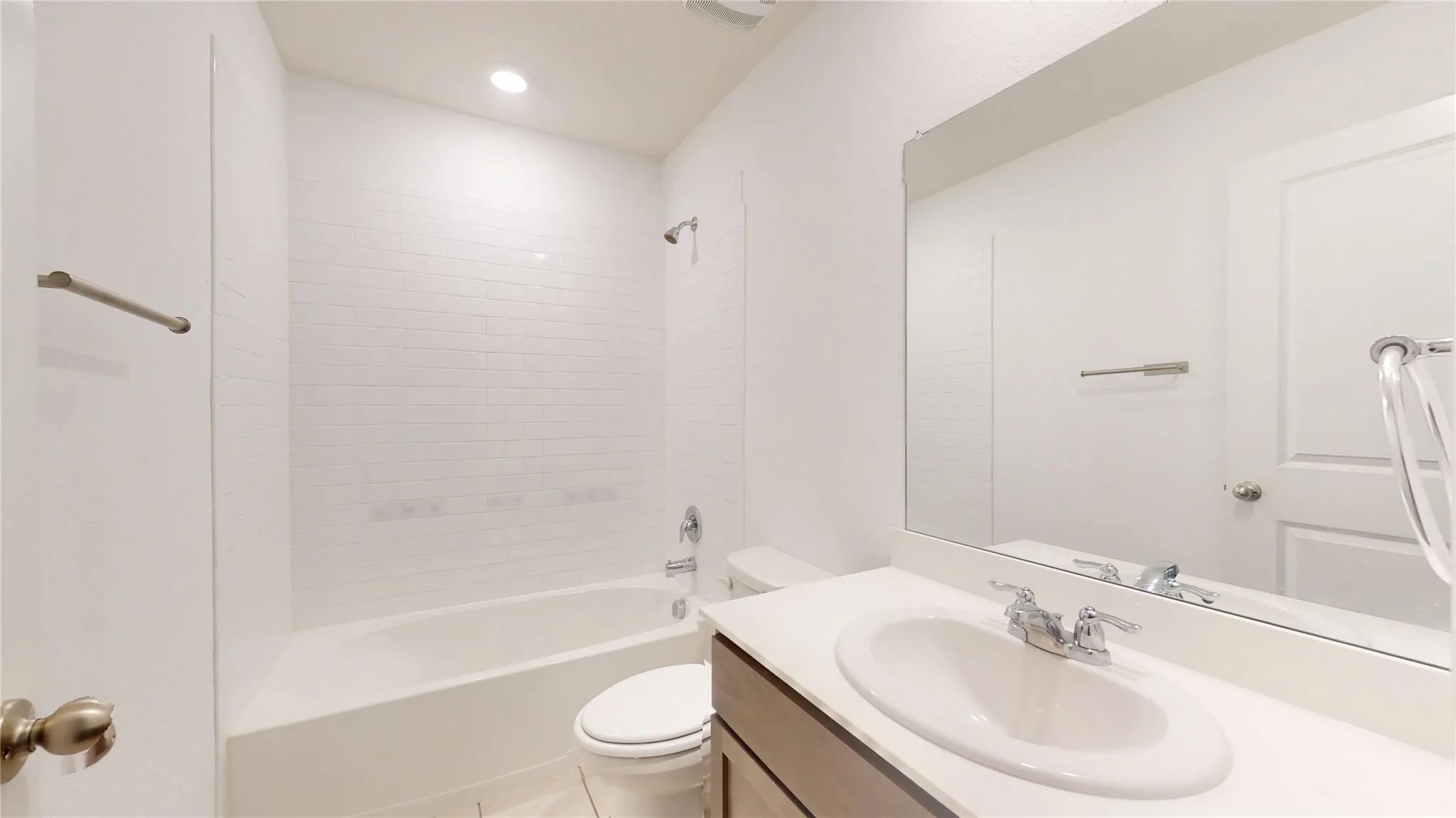 Bathroom vanity with a white countertop and integrated sink