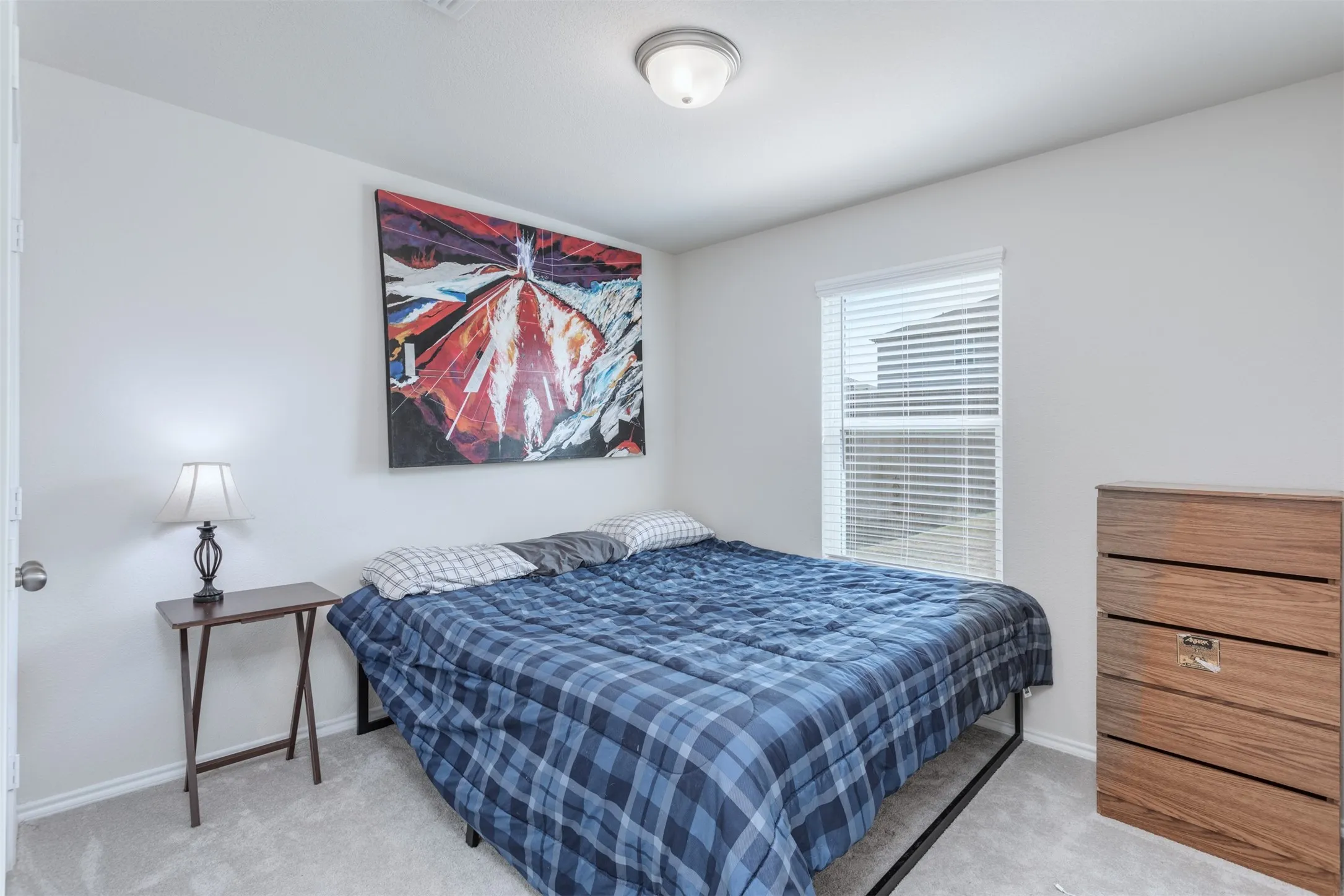 Downstairs bedroom is perfect for multi-generational living, a guest bedroom or an office.