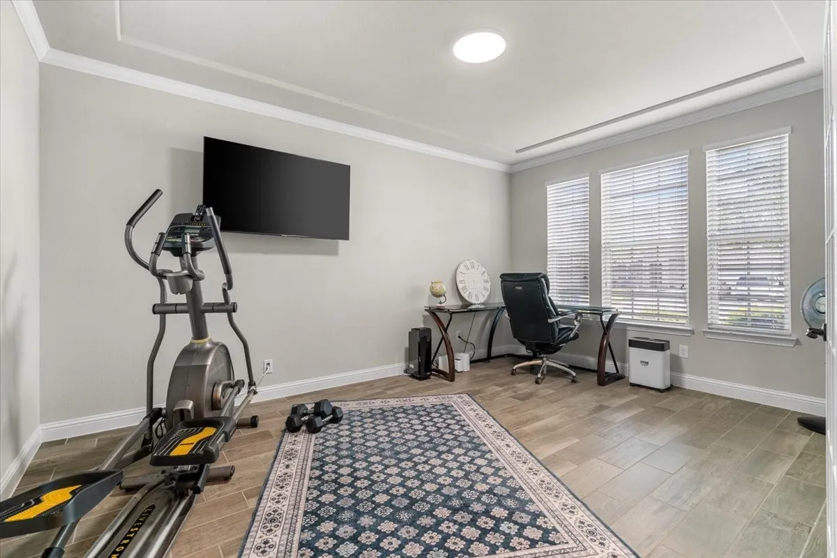 Expansive front room with endless uses as office space, gym, playroom or hobby room