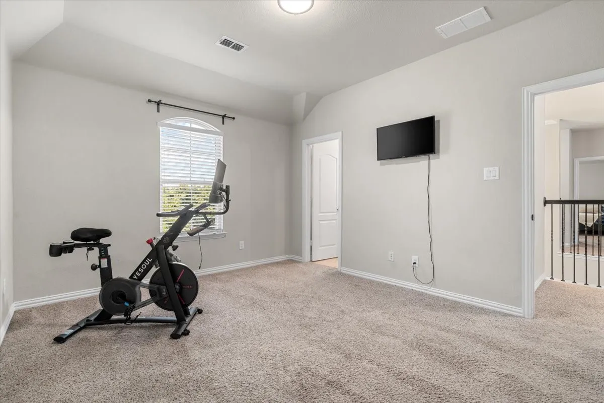 comfortably sized fourth bedroom with private ensuite bathroom